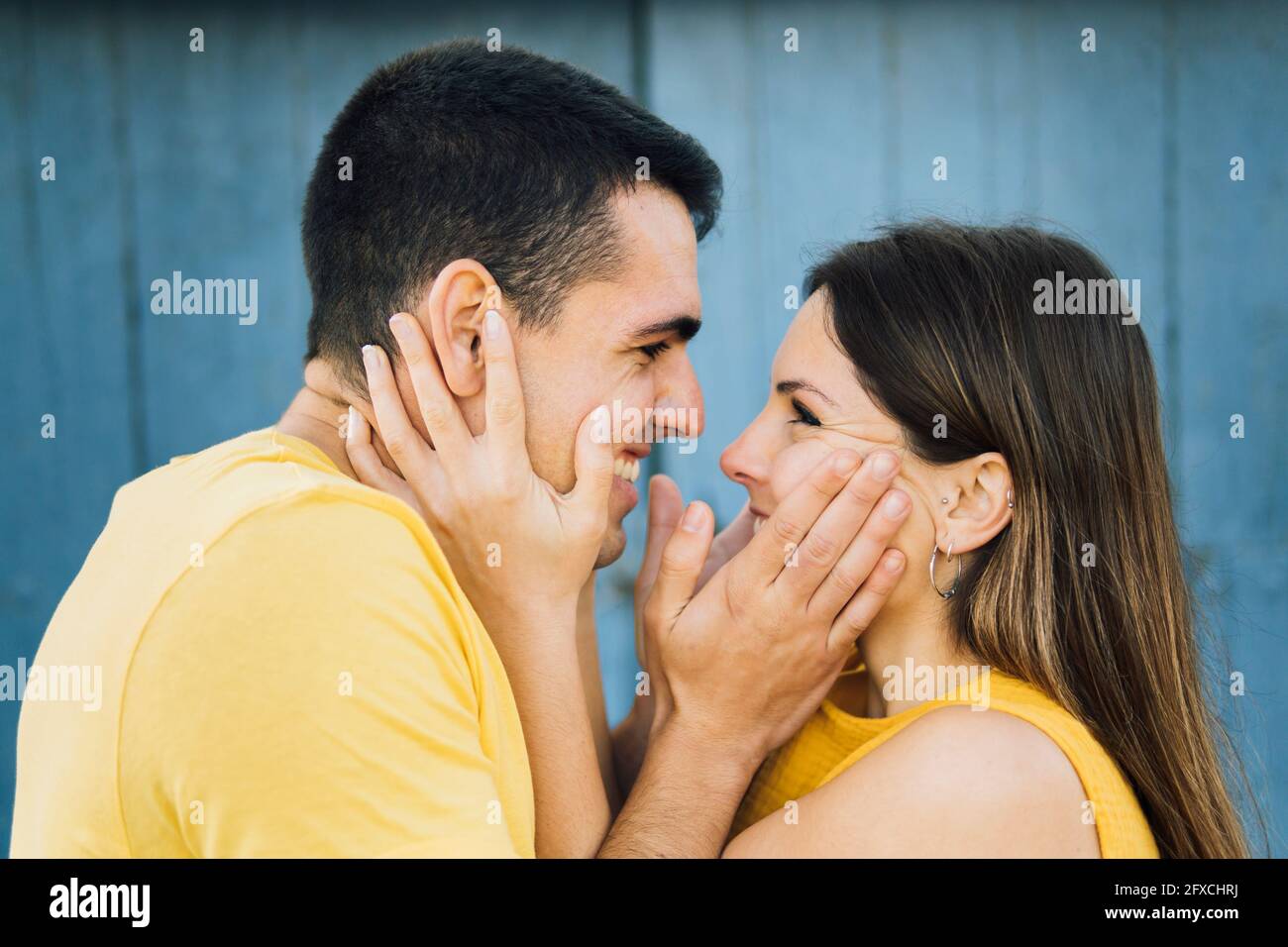 Affectionate couple smiling while looking at each other Stock Photo