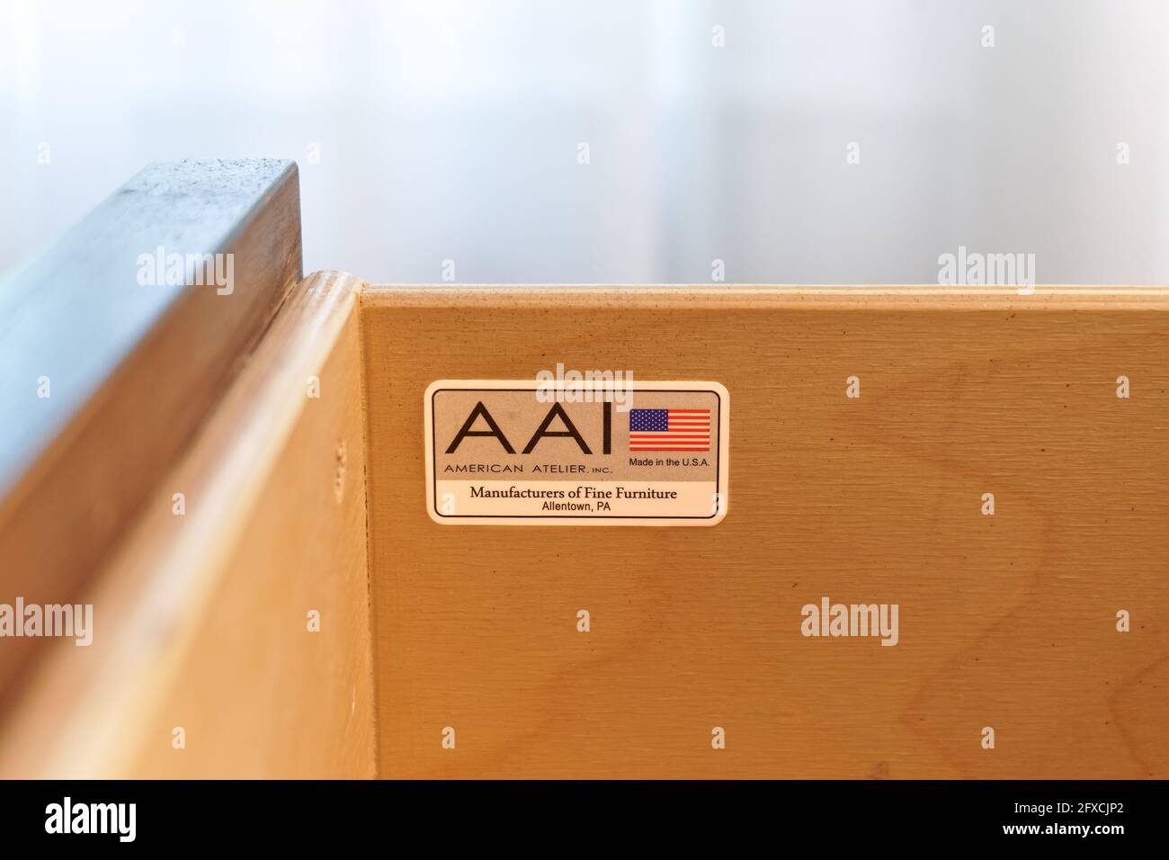 Galloway, NJ - May 14, 2021: Label inside the drawer of a hotel nightstand made by American Atelier, Inc. AAI manufactures custom furniture in Allento Stock Photo