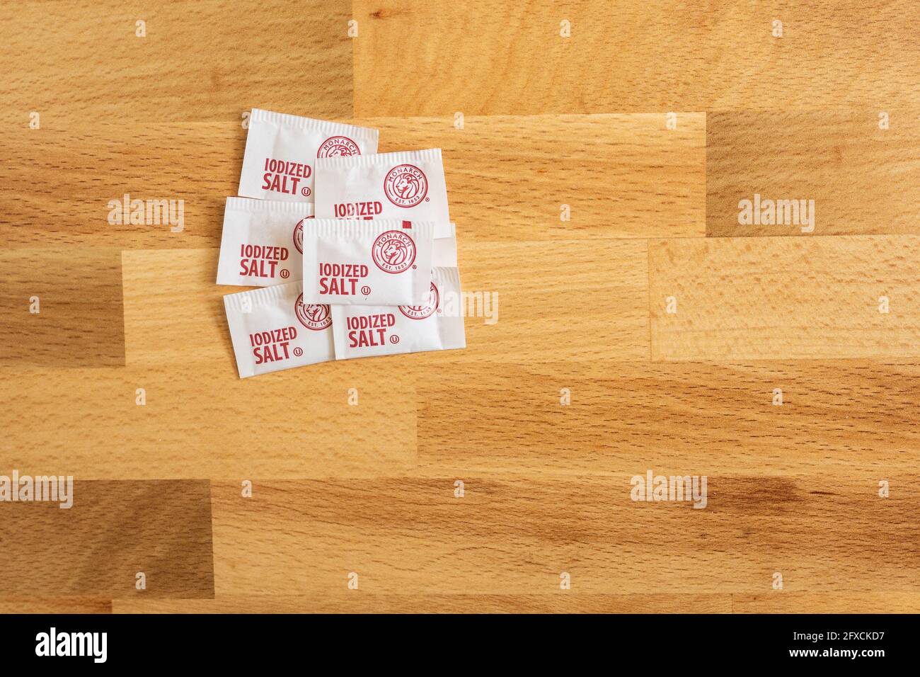 Flourtown, PA - May 26, 2021: Single serving packets of salt by Monarch, one of US Foods brands. US Foods is a leading foodservice distributor. Stock Photo