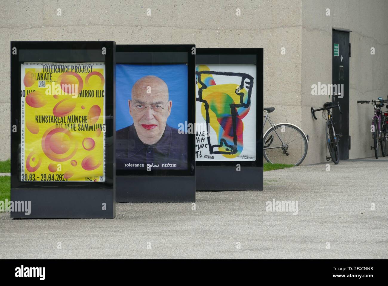 Tolerance Poster Project by Mirko Ilic takes place in Munich. Here behind glass in front of restaured old Pinakothek Munich. 29.03.-30.04.21. Stock Photo