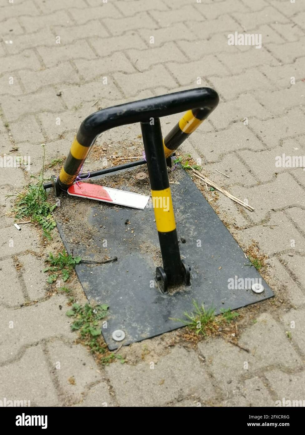 Painted parking space blocker on the paved road Stock Photo Alamy