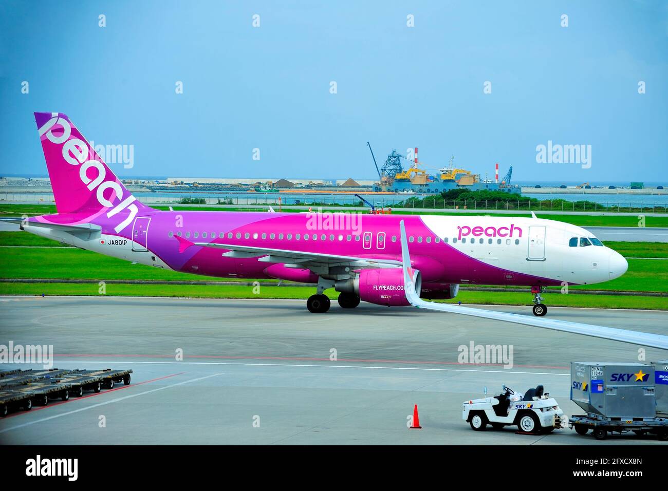 Peach, Airbus A320, JA810P, Taxiing to TO, Naha Airport, Naha, Okinawa, Ryukyu Islands, Japan Stock Photo