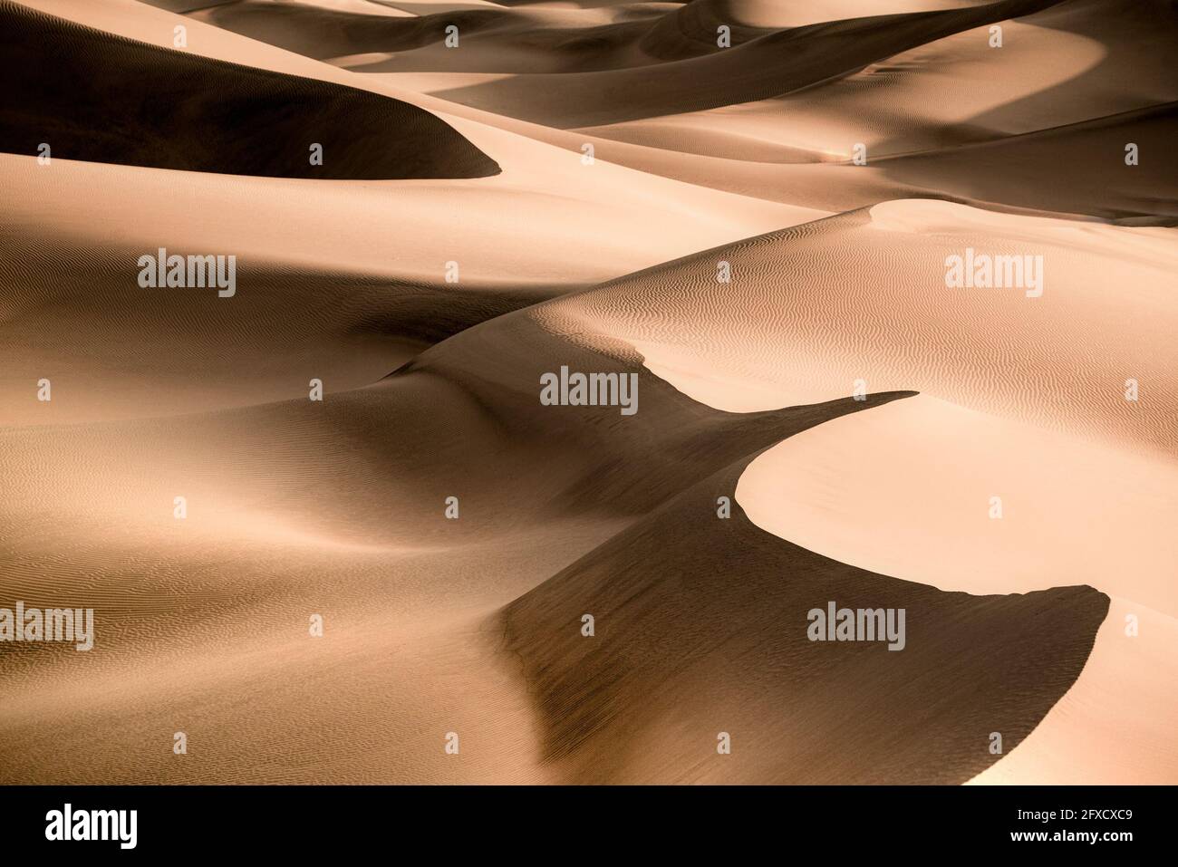Patterns and waves of Sand Dunes with ripples seen from Death Valley National Park, California Stock Photo