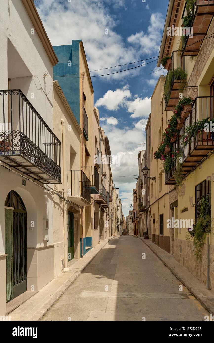 Typical narrow street with houses of the rural town of San Mateo, in the province of Castellon, Spain, Europe Stock Photo