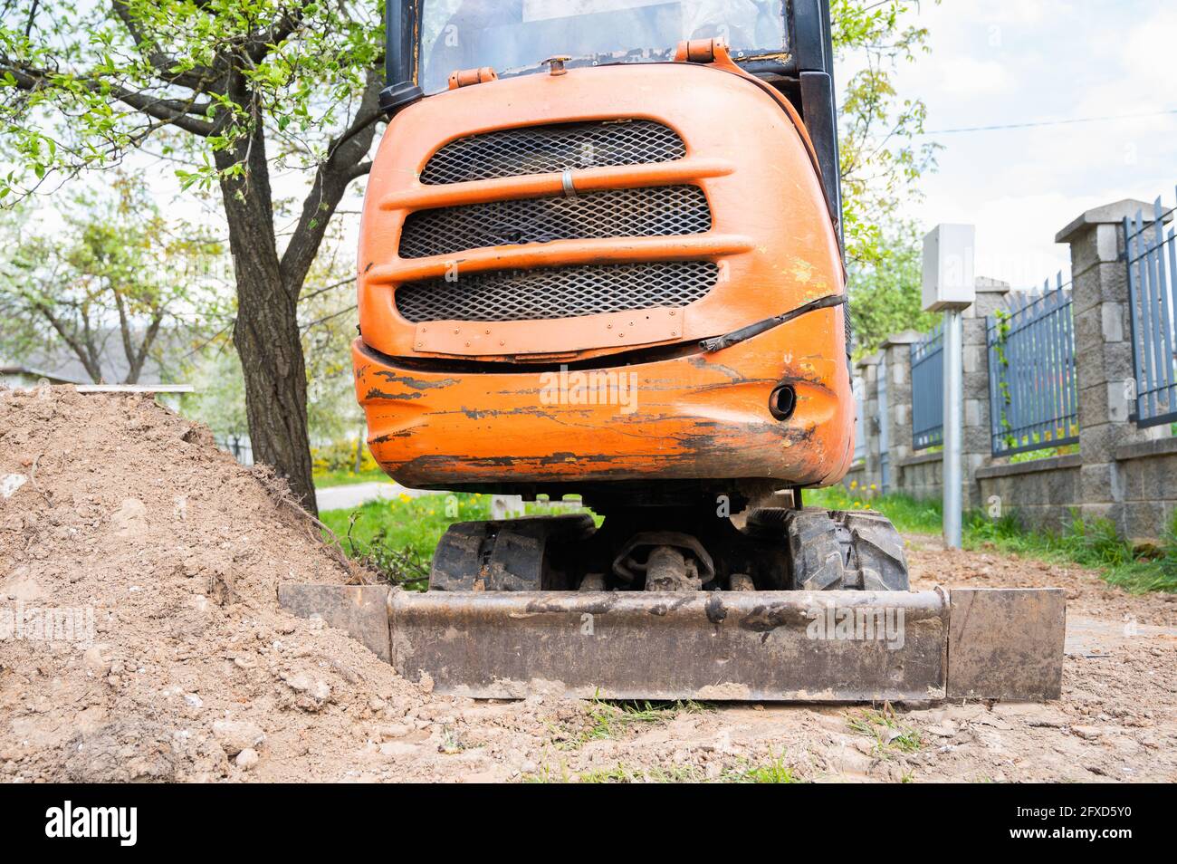 Mini excavator in orange color. construction equipment rental Stock Photo Alamy