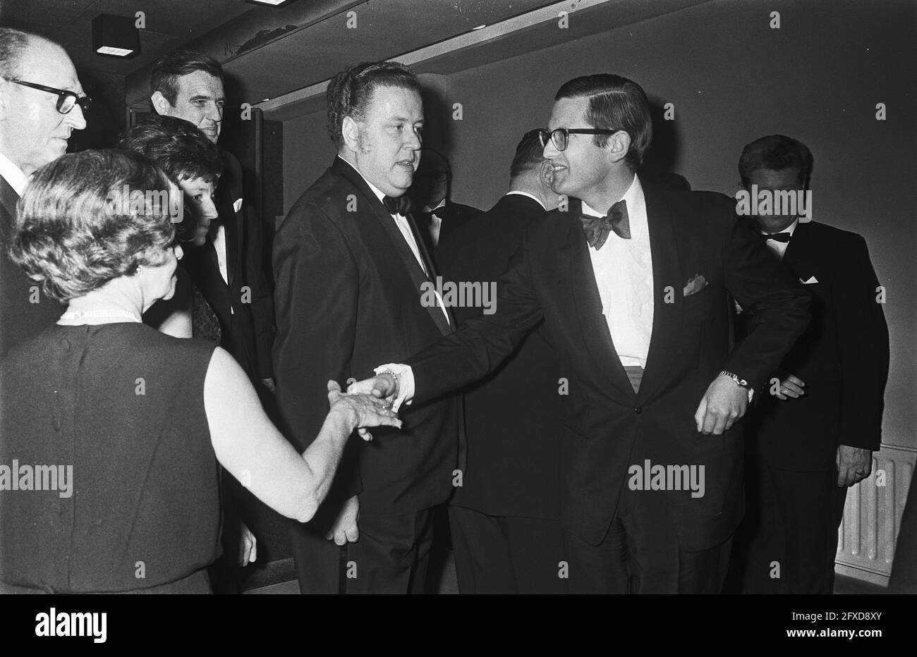 Princess Margriet and Mr. Van Vollenhoven attend premiere of space film Marooned at Cinerama Amsterdam. Pieter shakes hands, February 25, 1970, cinemas, films, royal family, premieres, princes, princesses, The Netherlands, 20th century press agency photo, news to remember, documentary, historic photography 1945-1990, visual stories, human history of the Twentieth Century, capturing moments in time Stock Photo