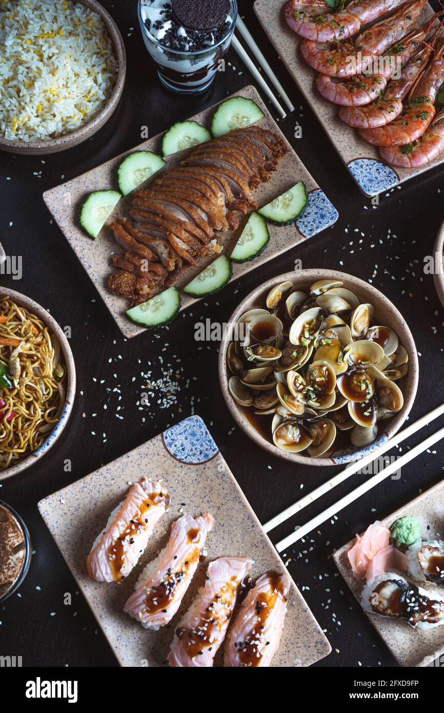 Overhead view of Japanese food served on table. Vertical image Stock Photo