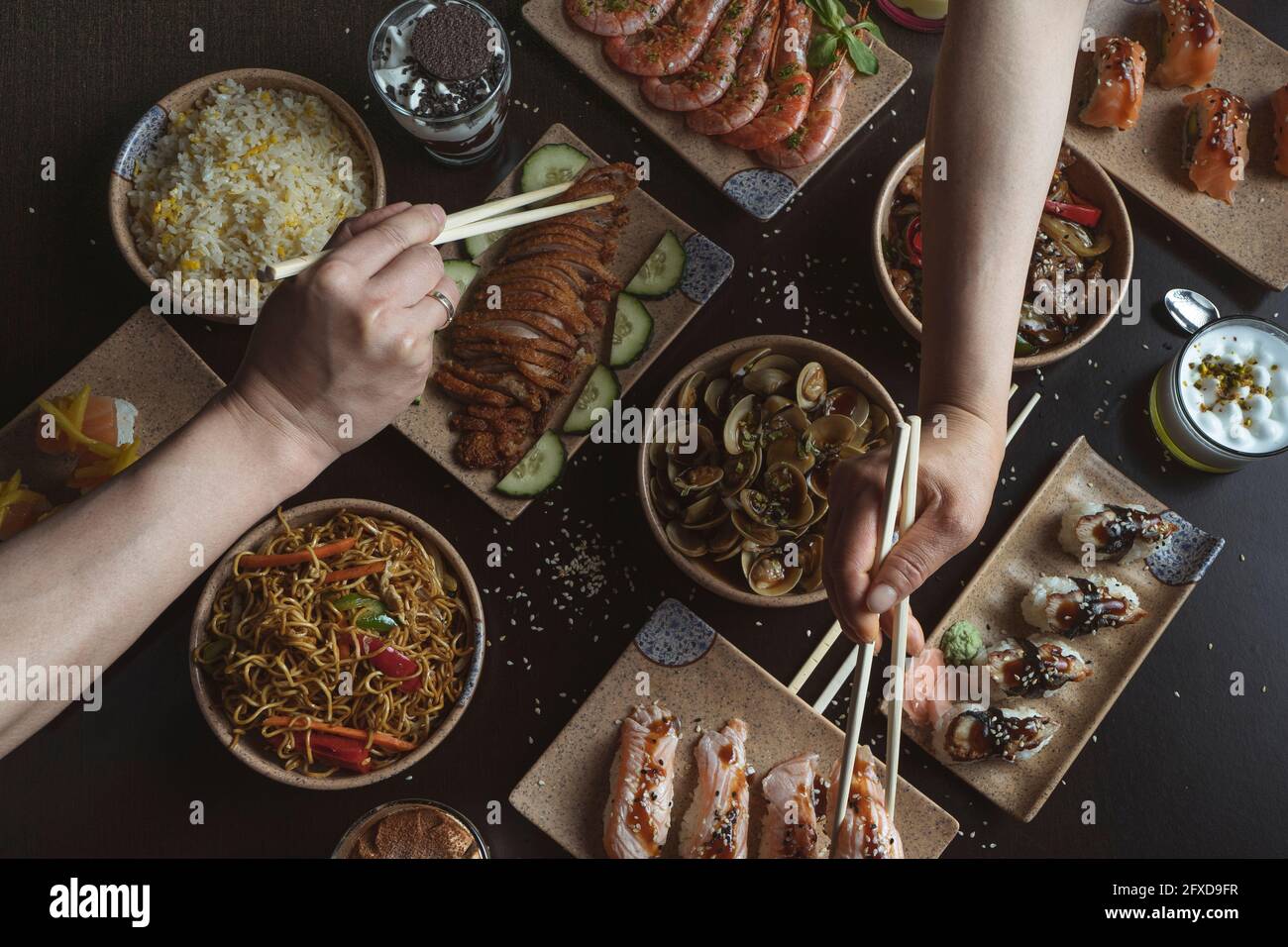 eating with chopsticks at the Japanese restaurant table Stock Photo
