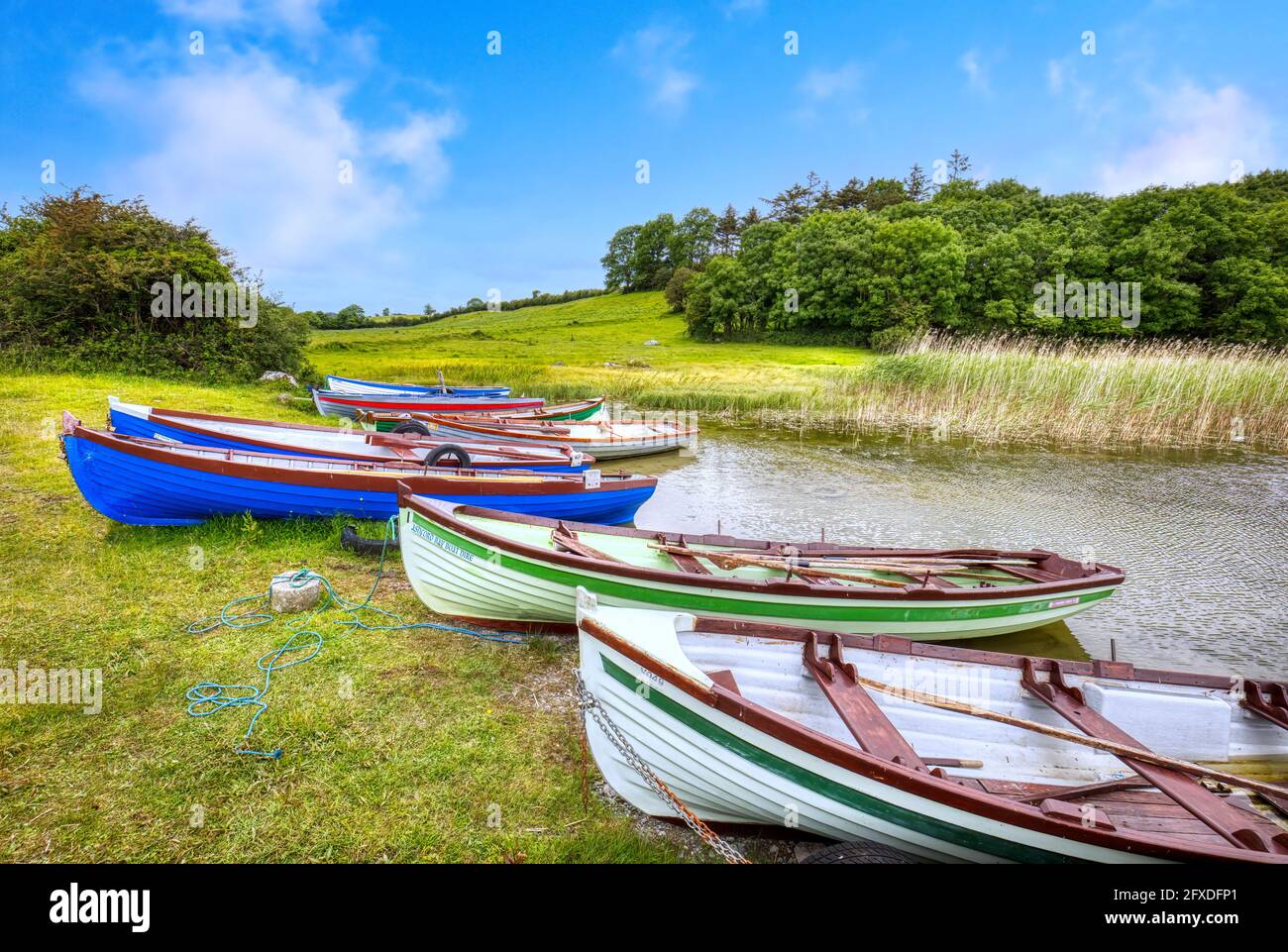 Colorful traditional Irish fishing boats on Lough Carra lake in western Ireland in County Mayo Ireland Stock Photo