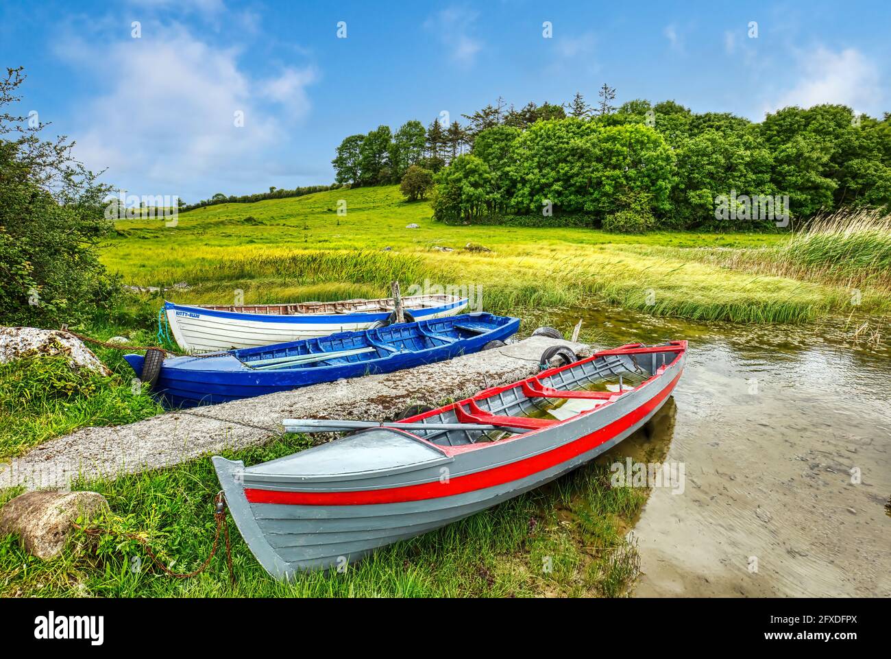 Colorful traditional Irish fishing boats on Lough Carra lake in western Ireland in County Mayo Ireland Stock Photo