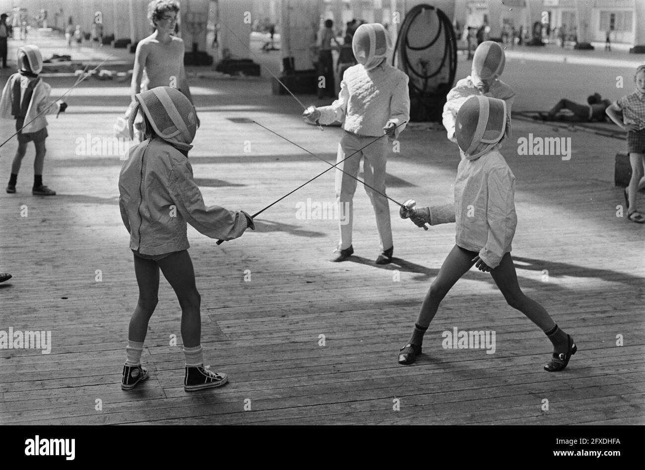Sports and games for children in vacation in Old RAI, Amsterdam; girls  fencing, July 13, 1970, Children, The Netherlands, 20th century press  agency photo, news to remember, documentary, historic photography  1945-1990, visual