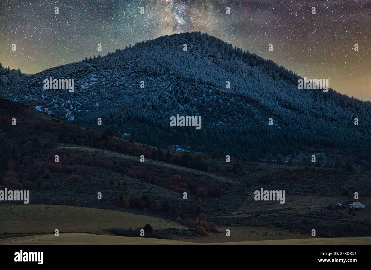 Beautiful view of the Milky Way Galaxy over a mountainous landscape ...