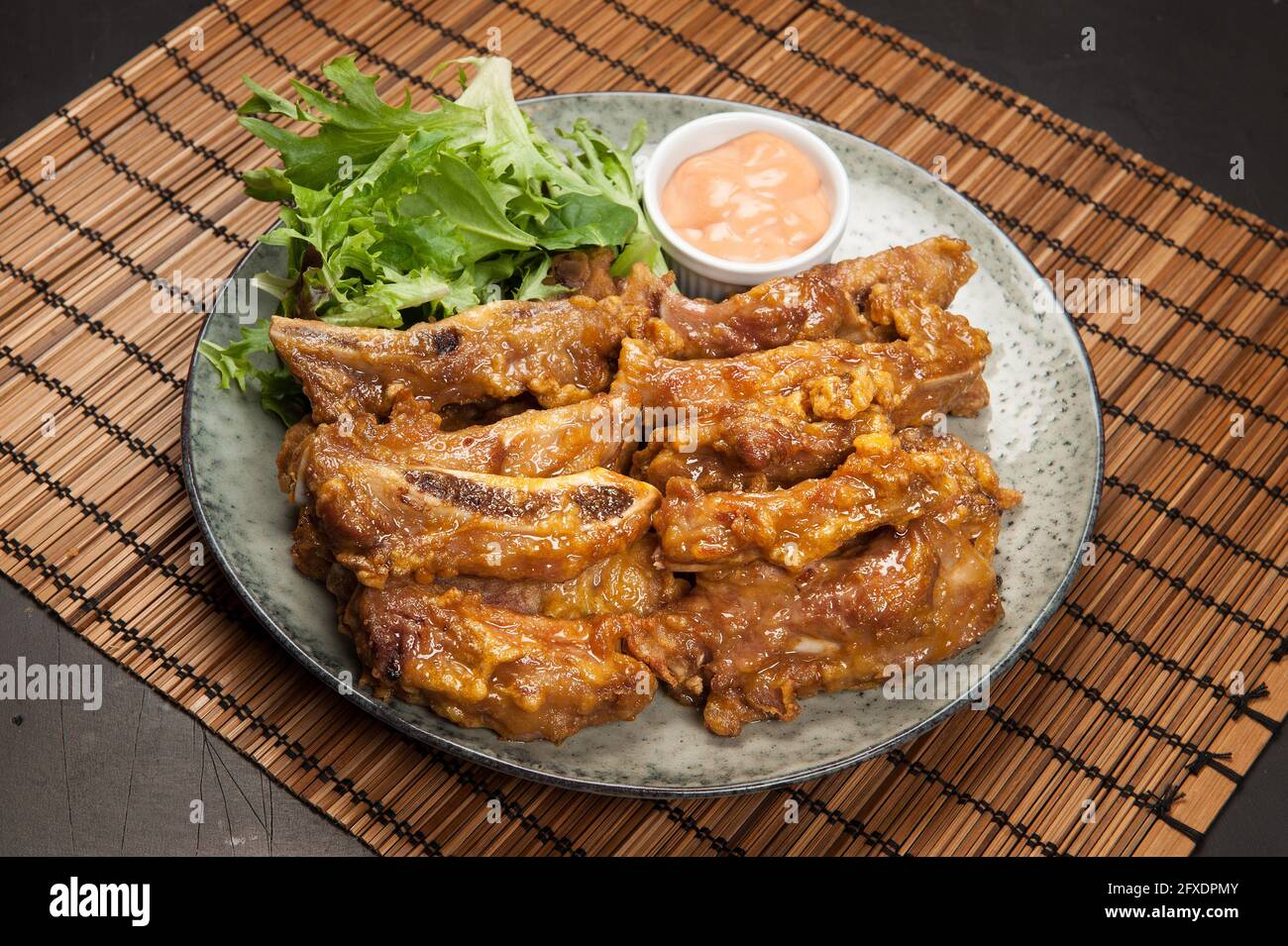 Beef ribs in sauce at a Korean restaurant. Stock Photo