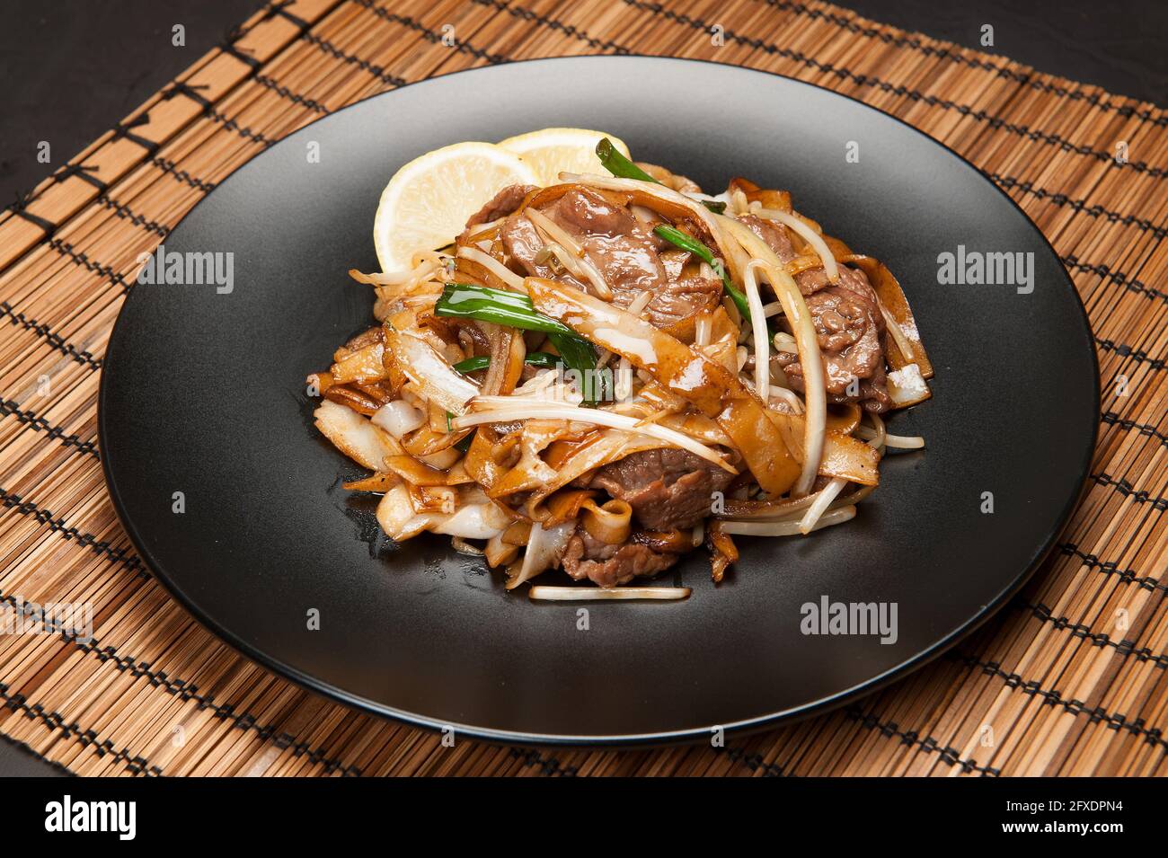 Beef in black bean sauce with flat rice noodles at a Korean restaurant