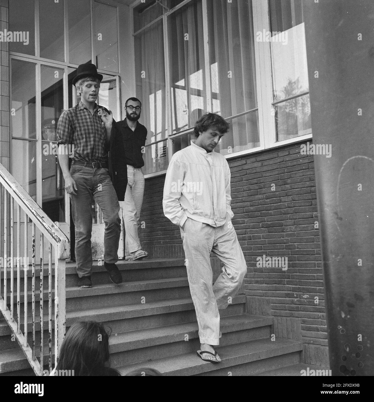 Stolk, Van Duyn and Grootveld leave the police station, August 14, 1965, activists, police, The Netherlands, 20th century press agency photo, news to remember, documentary, historic photography 1945-1990, visual stories, human history of the Twentieth Century, capturing moments in time Stock Photo
