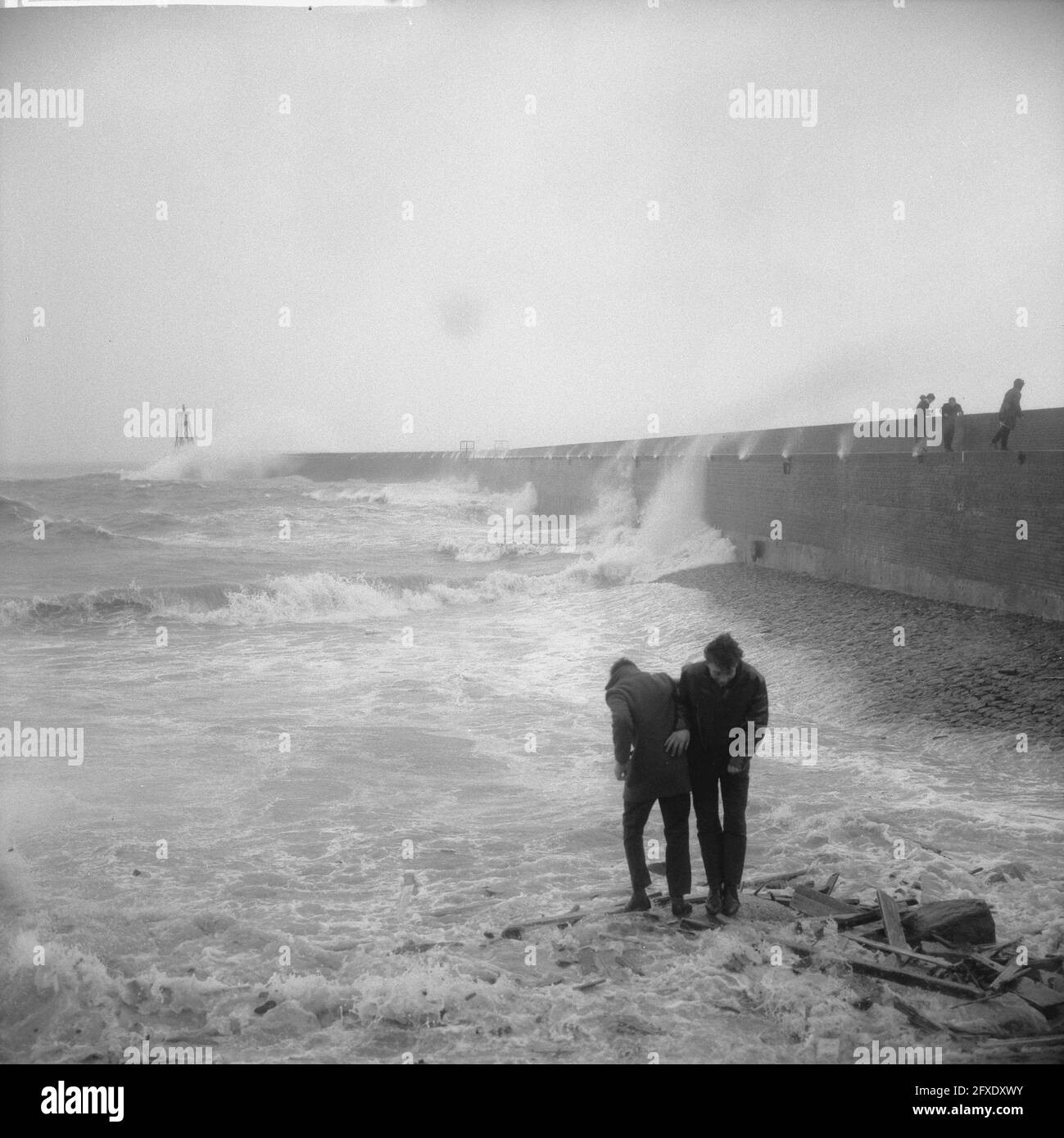 Wind force 10, fishing boat enters harbor of Scheveningen, February 23,  1967, Fishing boats, harbors, The Netherlands, 20th century press agency  photo, news to remember, documentary, historic photography 1945-1990,  visual stories, human