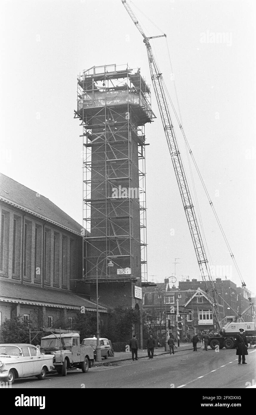 Cupola being hoisted onto tower of the Emmen Reformed Church the tower