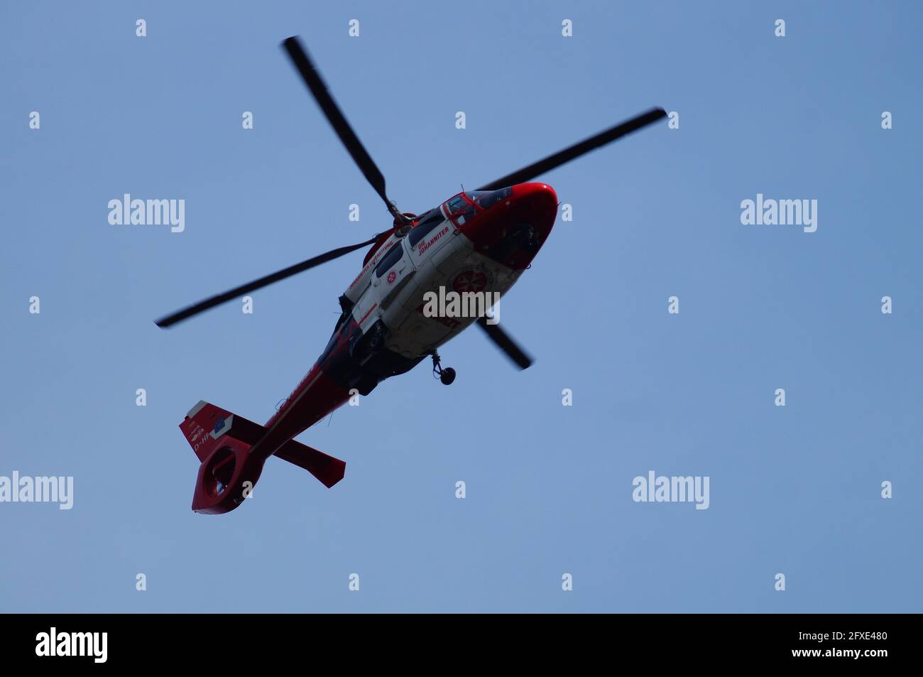 FRANKFURT, GERMANY - May 03, 2021: A Johanniter Unfallhilfe rescue helicopter leaves the Northwest Hospital in Frankfurt. The machine is mainly used f Stock Photo