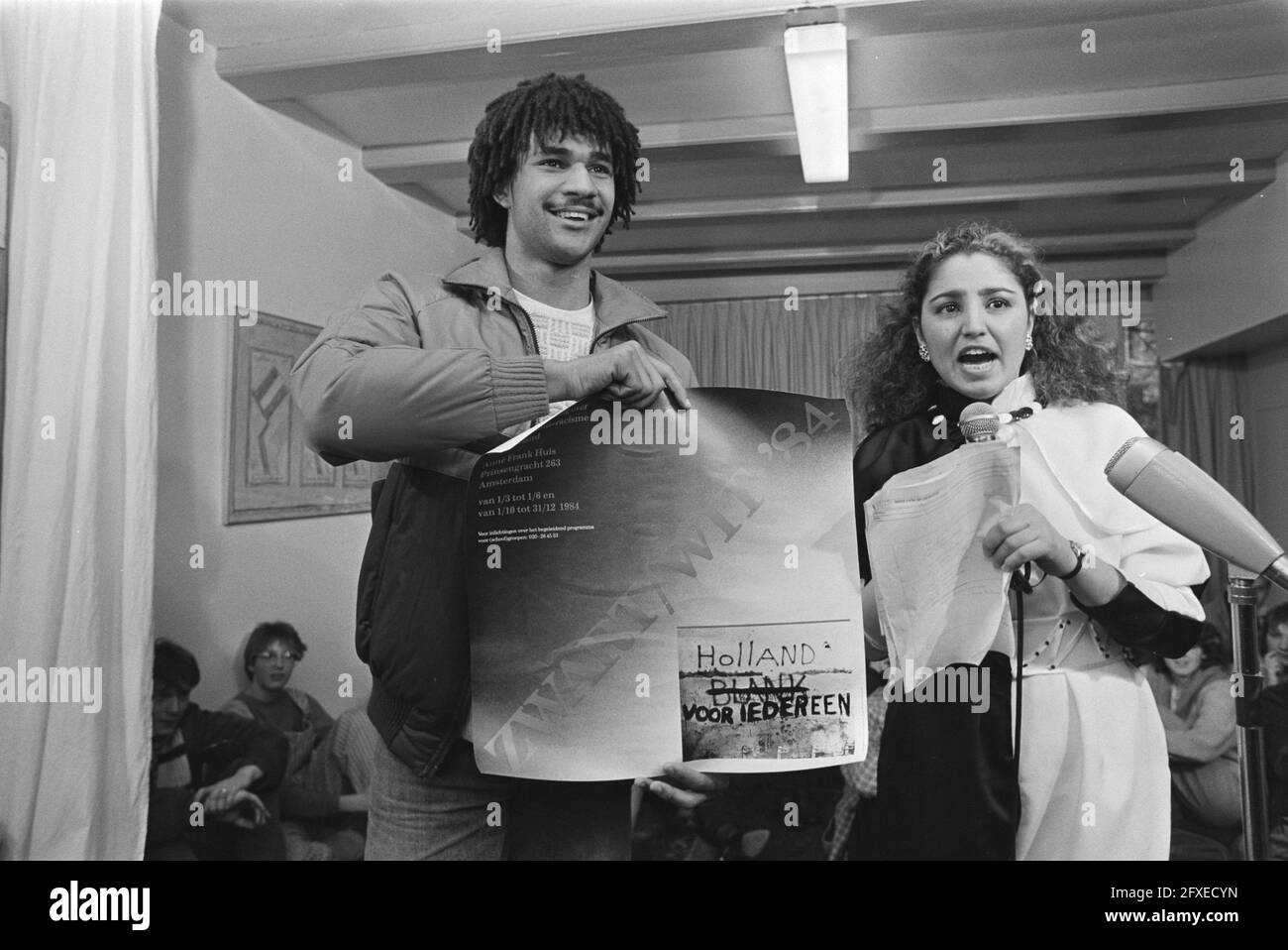 Tent. Zwart Wit on racism opened byRuud Gullit (Ajax) (Amsterdam); with  poster and Gulnaz Aslan (presenter Radio Thuisland), 29 February 1984,  RACISM, posters, exhibitions, The Netherlands, 20th century press agency  photo, news
