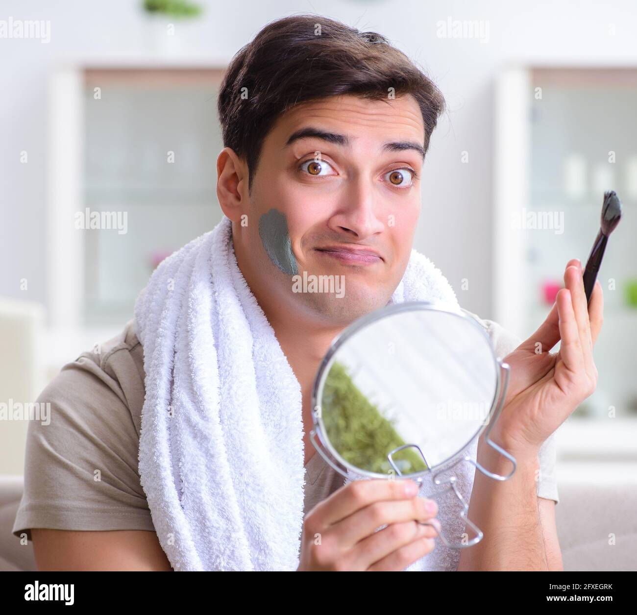 Man peeling off mask hi-res stock photography and images - Alamy