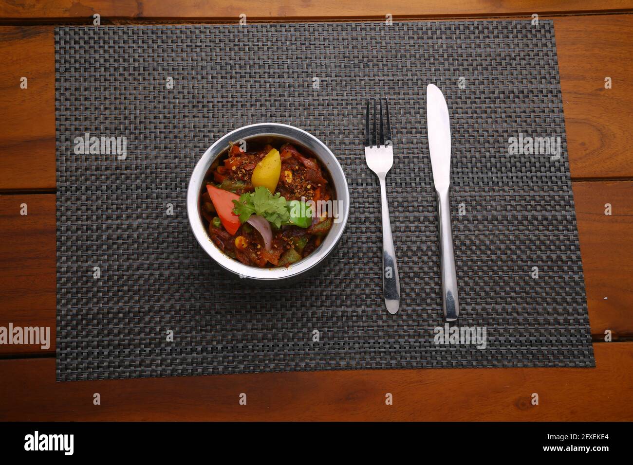 Indian dish Veg Kolhapuri, north indian dish arranged in a steel bowl which is made using mixed vegetables,spicy dish a good combination for chappati Stock Photo