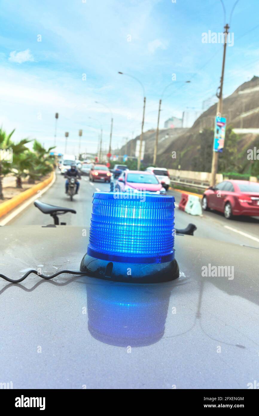 Group of professional cyclists training on highway with safety escort