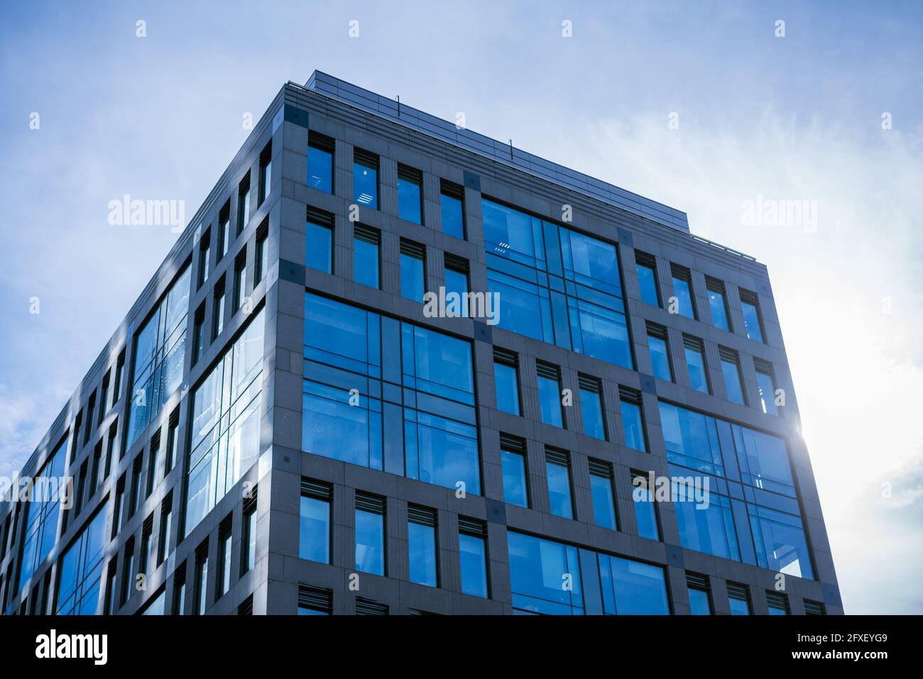 Glass facades of office buildings against a blue sky Stock Photo - Alamy