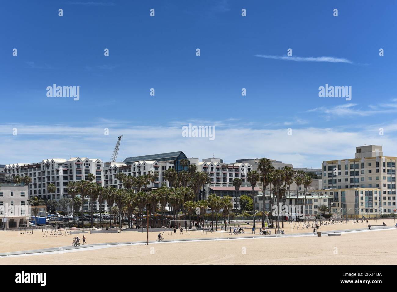 SANTA MONICA, CALIFORNIA - 25 MAY 2021: View from the Santa Monica Pier looking towards Ocean Front Walk and the original Muscle Beach site. Stock Photo