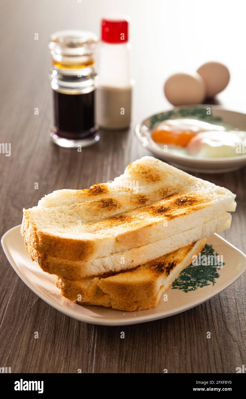 Common oriental breakfast set in Malaysia consisting of coffee, nasi