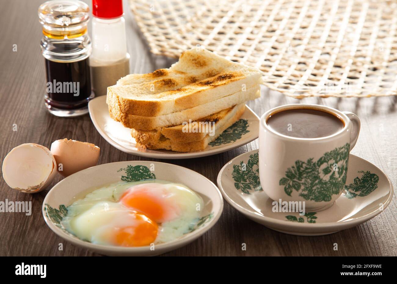 Common oriental breakfast set in Malaysia consisting of coffee, nasi