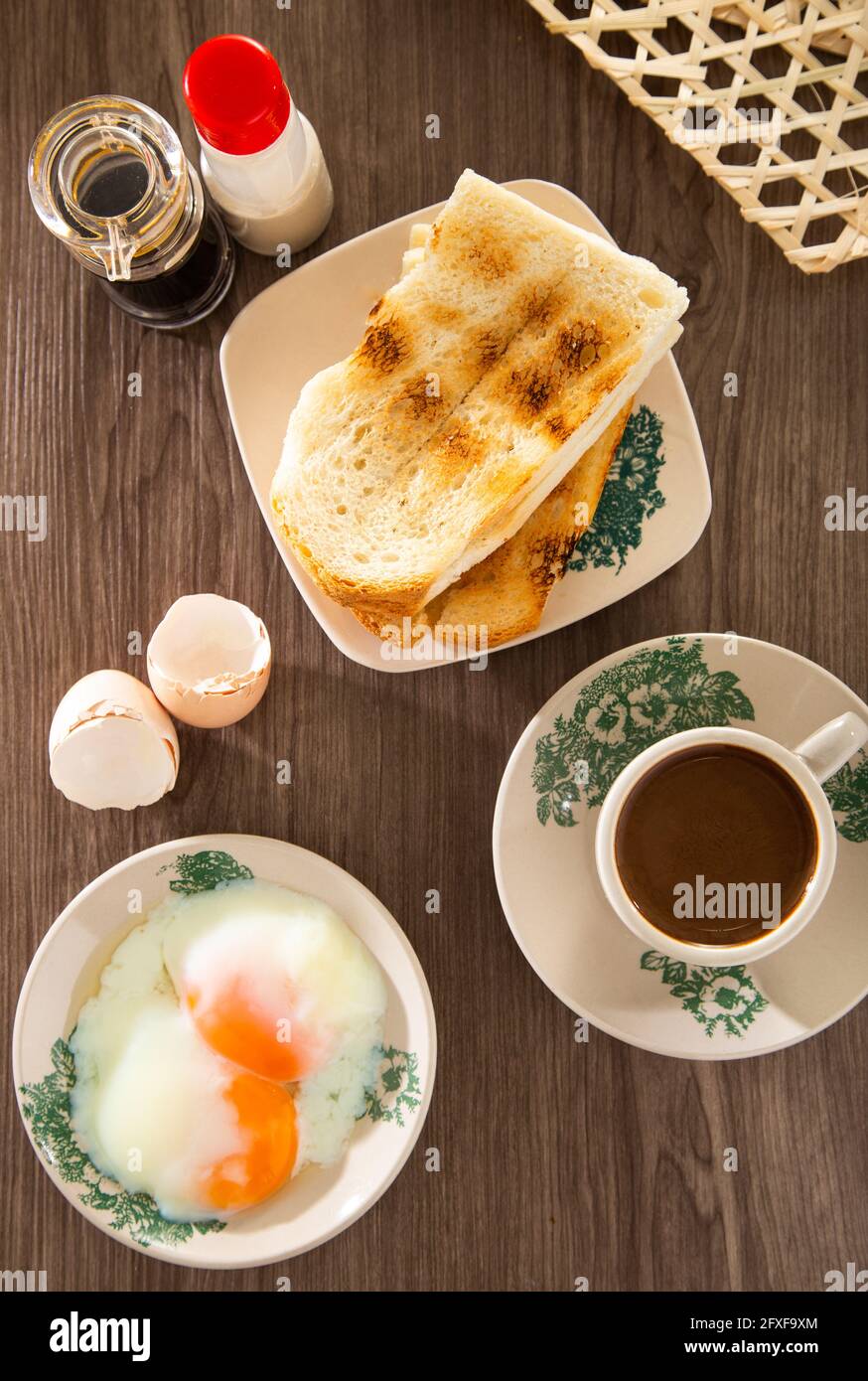 Common oriental breakfast set in Malaysia consisting of coffee, nasi