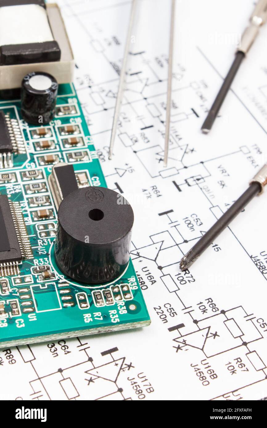 Printed circuit board with transistors, resistors, capacitor. Diagram of electronics and