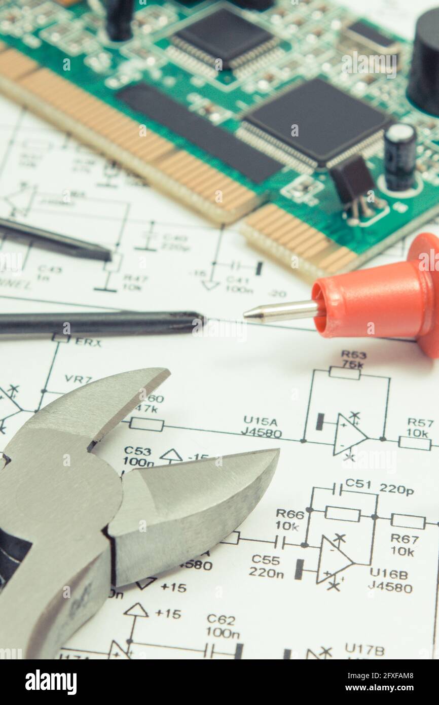 Printed circuit board with transistors, resistors, capacitor. Diagram of electronics, cable of