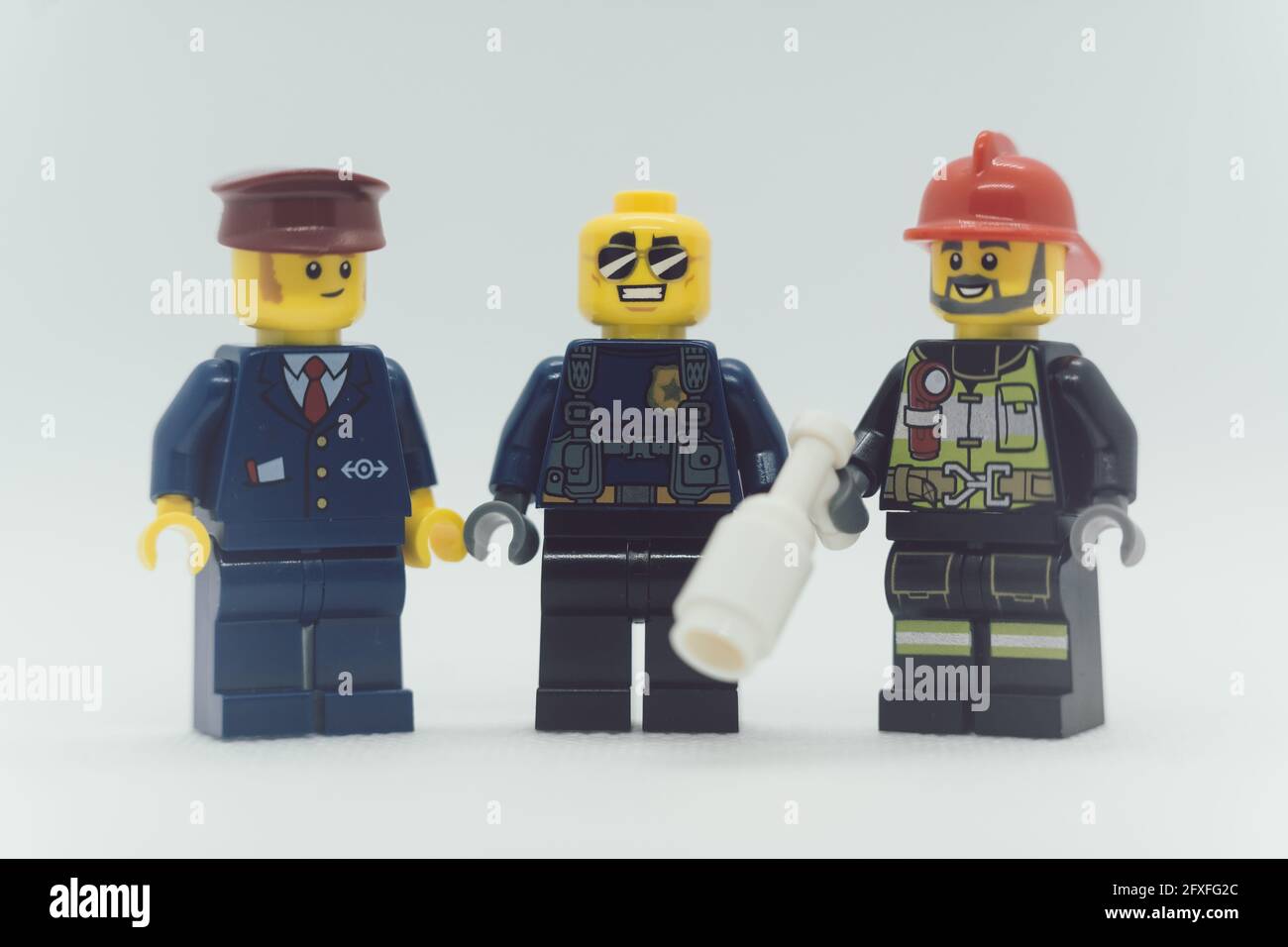 MUNICH, GERMANY - May 16, 2021: Lego figures of firemen and policemen  against white background. Macro shot as a concept for childhood hero Stock  Photo - Alamy