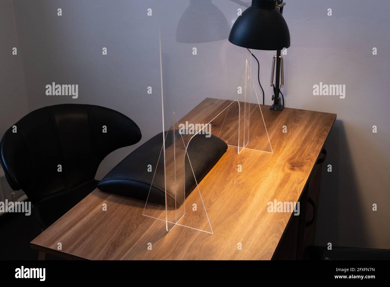 Manicure table with protective shield. Manicurist workplace with