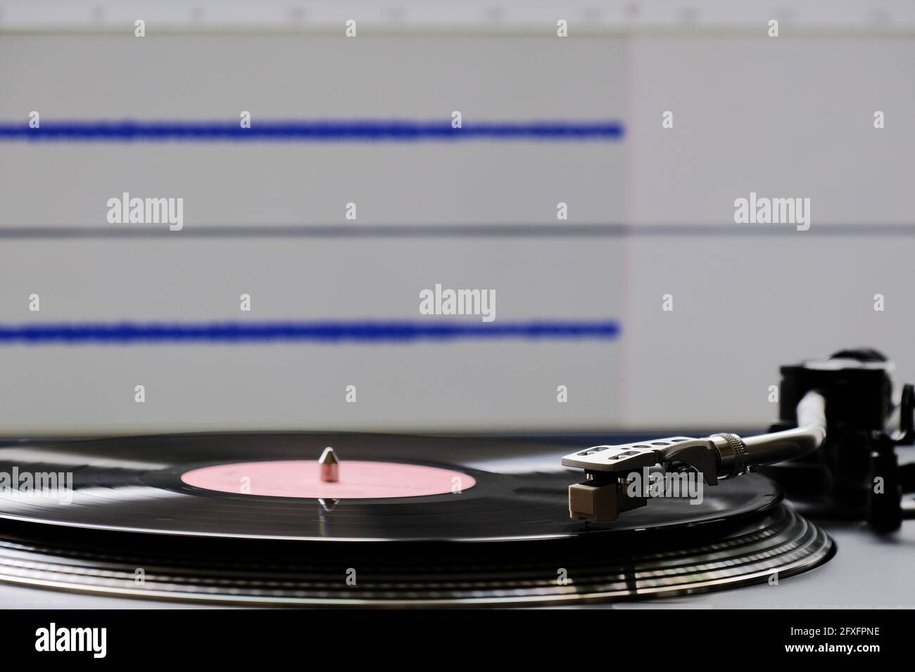The process of digitizing vinyl records using a turntable and a
