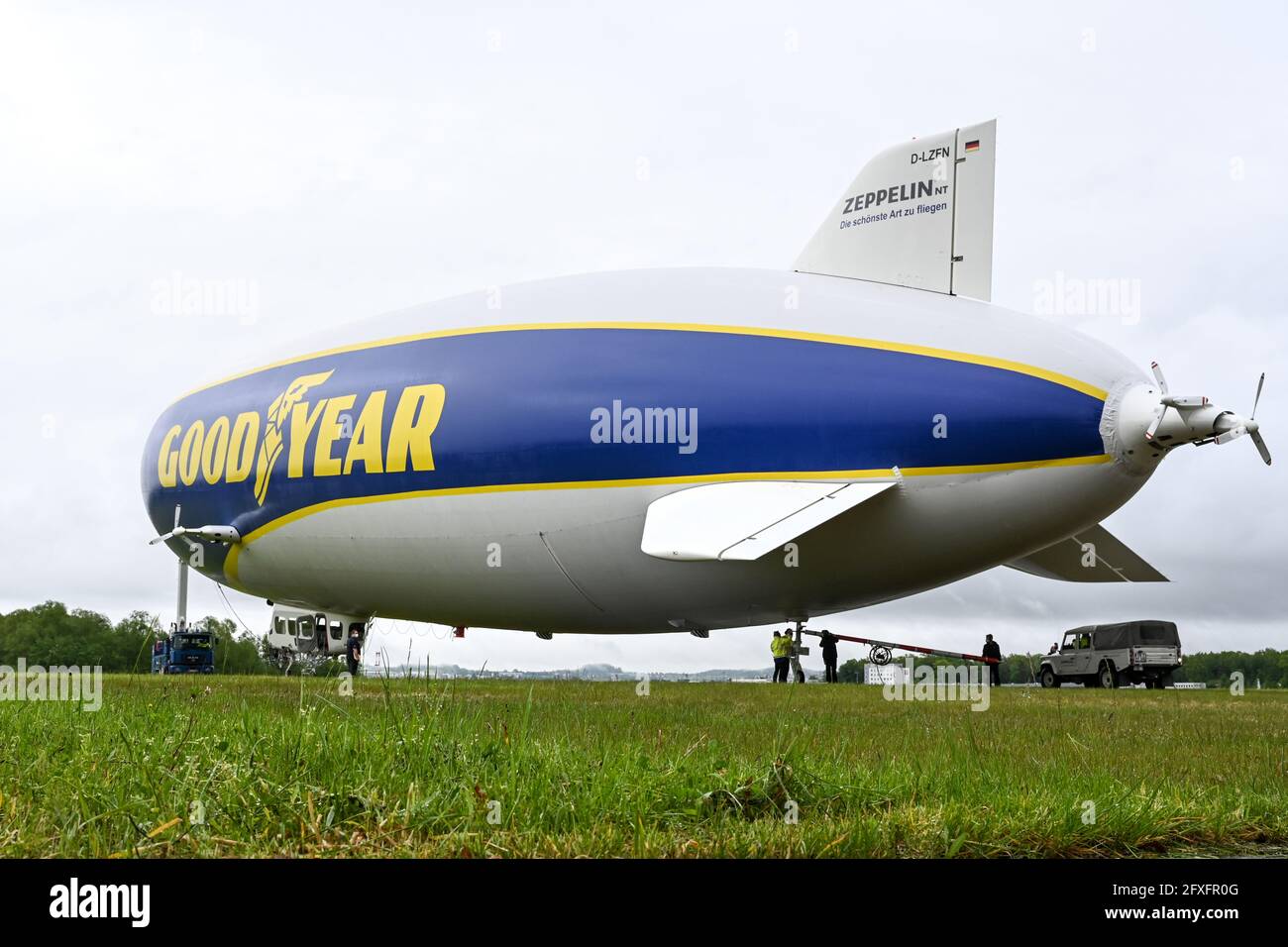 Friedrichshafen, Germany. 27th May, 2021. The Zeppelin NT (New Technology) is pulled out of the hangar by a truck so that the airship can take off for the press flight in the afternoon. On Friday, 28.05.2021 the Zeppelin NT starts into the season. Credit: Felix Kästle/dpa/Alamy Live News Stock Photo