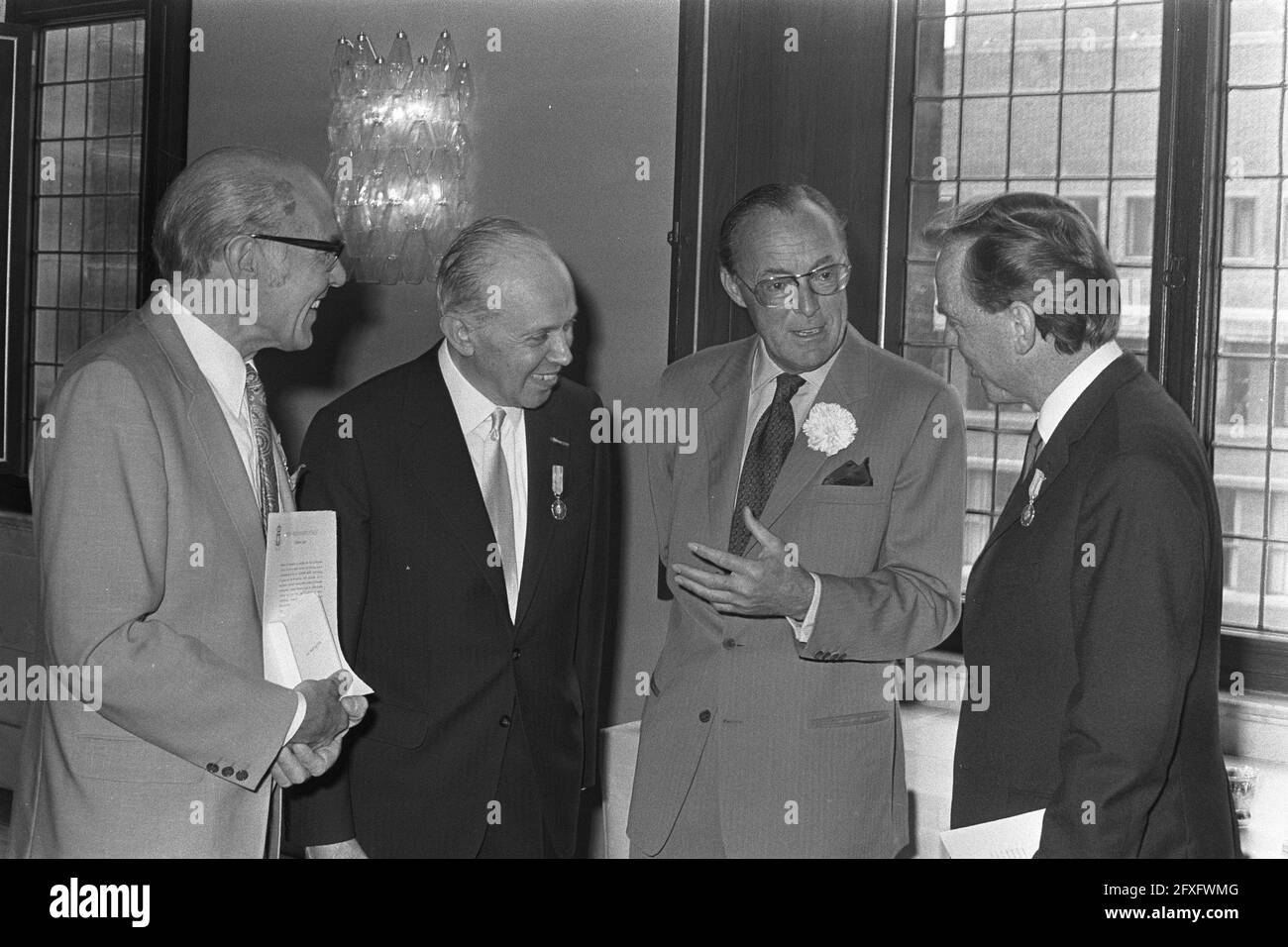 From left to right Mr. Frans Nieuwboer, Mr. M. H. Gans, Prince Bernhard and Mr. L. G. le Roy, during the award ceremony in the Palace on the Dam in Amsterdam, June 27, 1972, awards, palaces, award ceremonies, princes, The Netherlands, 20th century press agency photo, news to remember, documentary, historic photography 1945-1990, visual stories, human history of the Twentieth Century, capturing moments in time Stock Photo