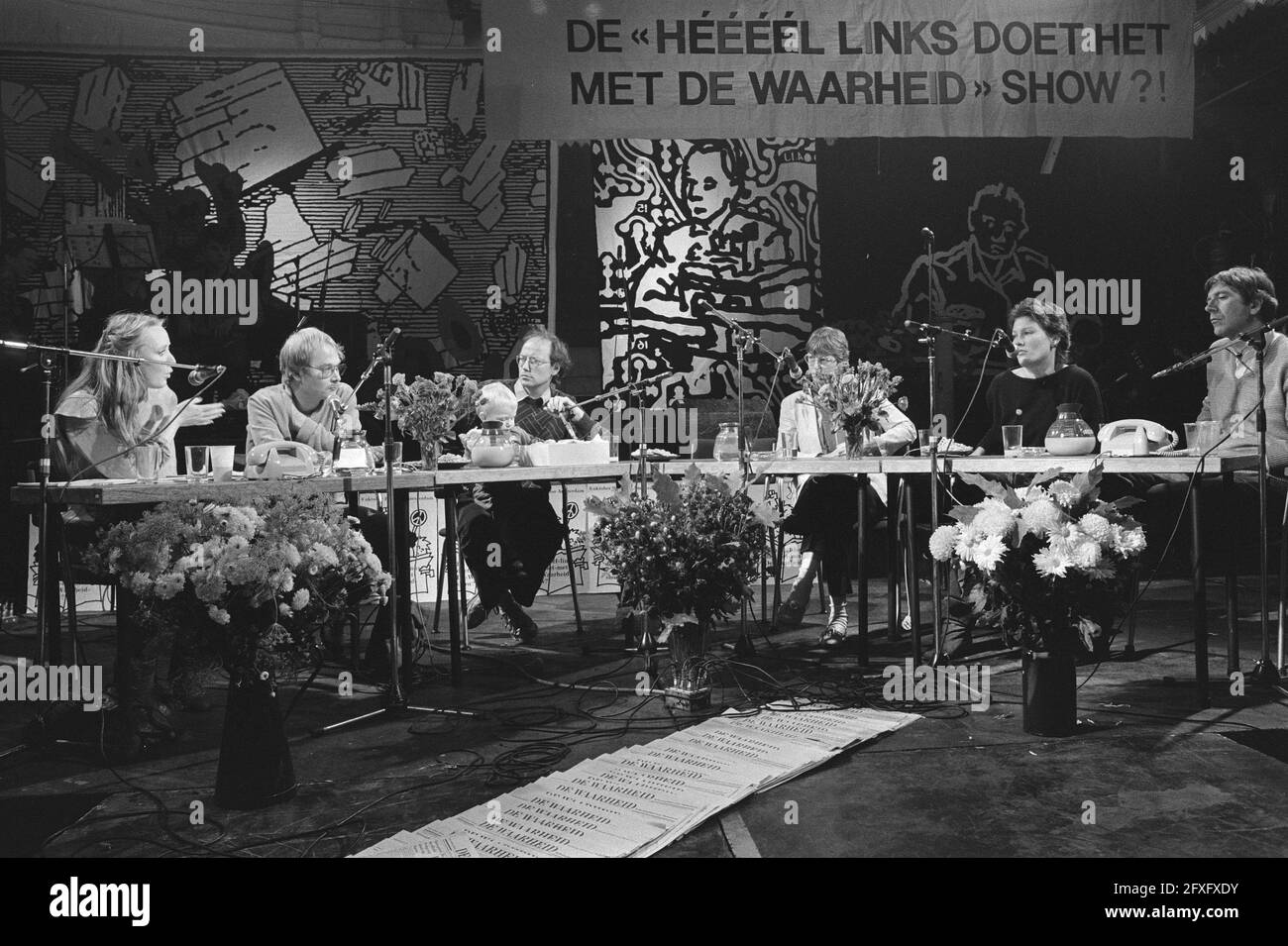 From left to right, unknown, Mr. Walter Etty, Ms. Evelien Eshuis (CPN), Ms. Andrée van Es (PSP) and Mr. Peter Lankhordt (PPR) during a forum discussion on the Truth. In the foreground a stack with the daily newspaper De Waarheid, October 8, 1983, communism, conferences, newspapers, The Netherlands, 20th century press agency photo, news to remember, documentary, historic photography 1945-1990, visual stories, human history of the Twentieth Century, capturing moments in time Stock Photo