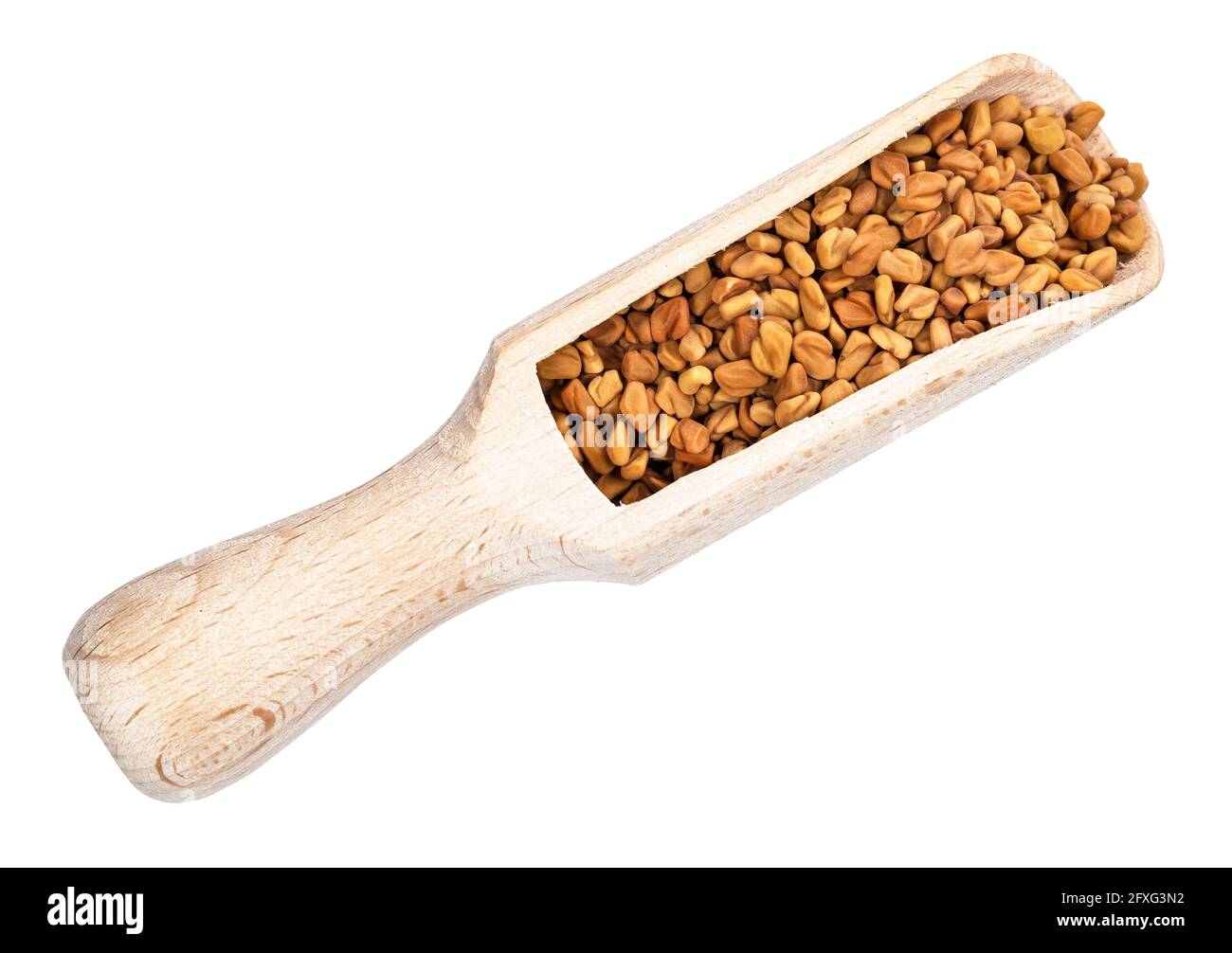 top view of Fenugreek seeds in wood scoop cutout on white background Stock Photo