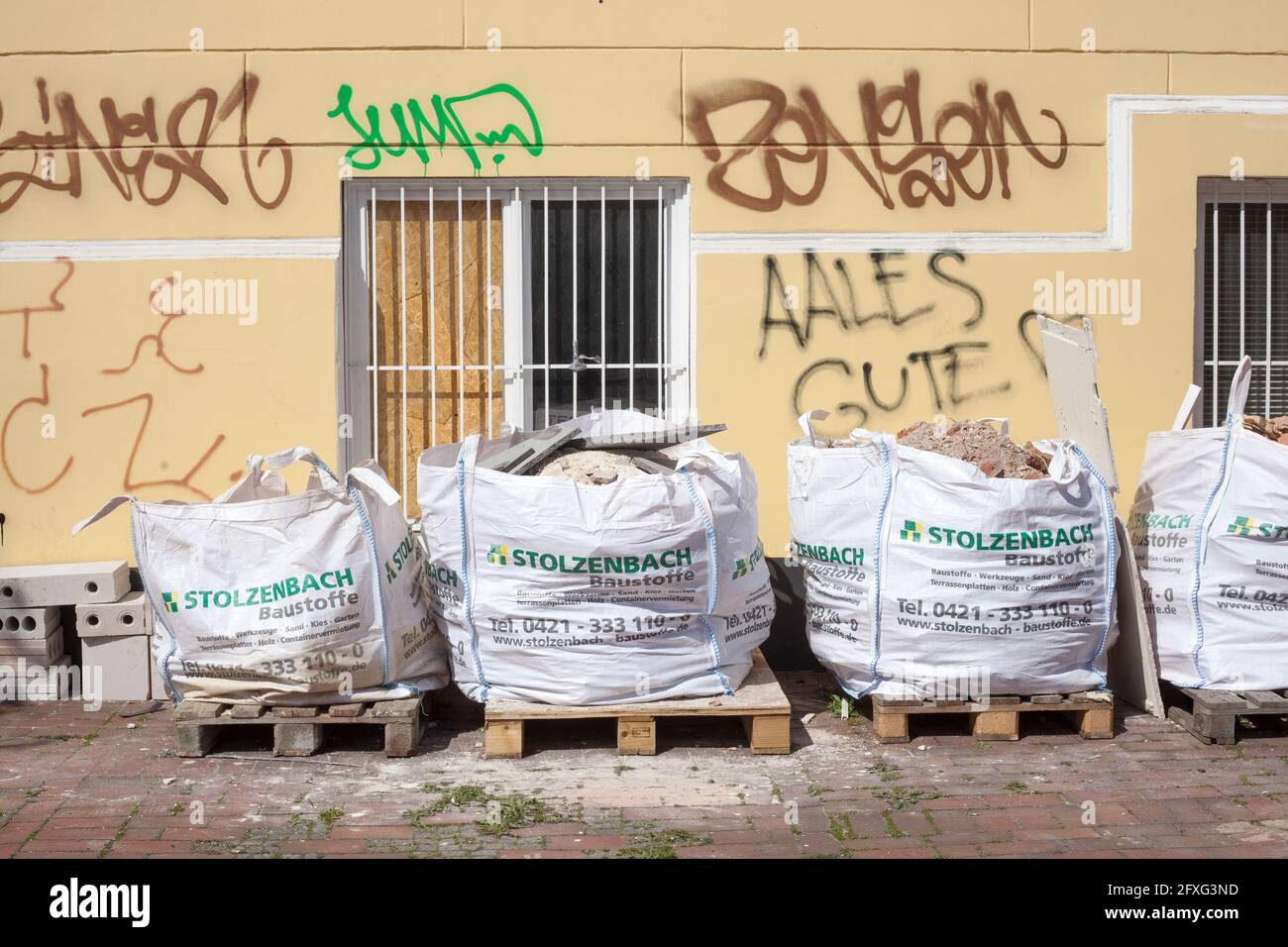 Garbage bags filled with rubble standing on the street, Germany, Europe