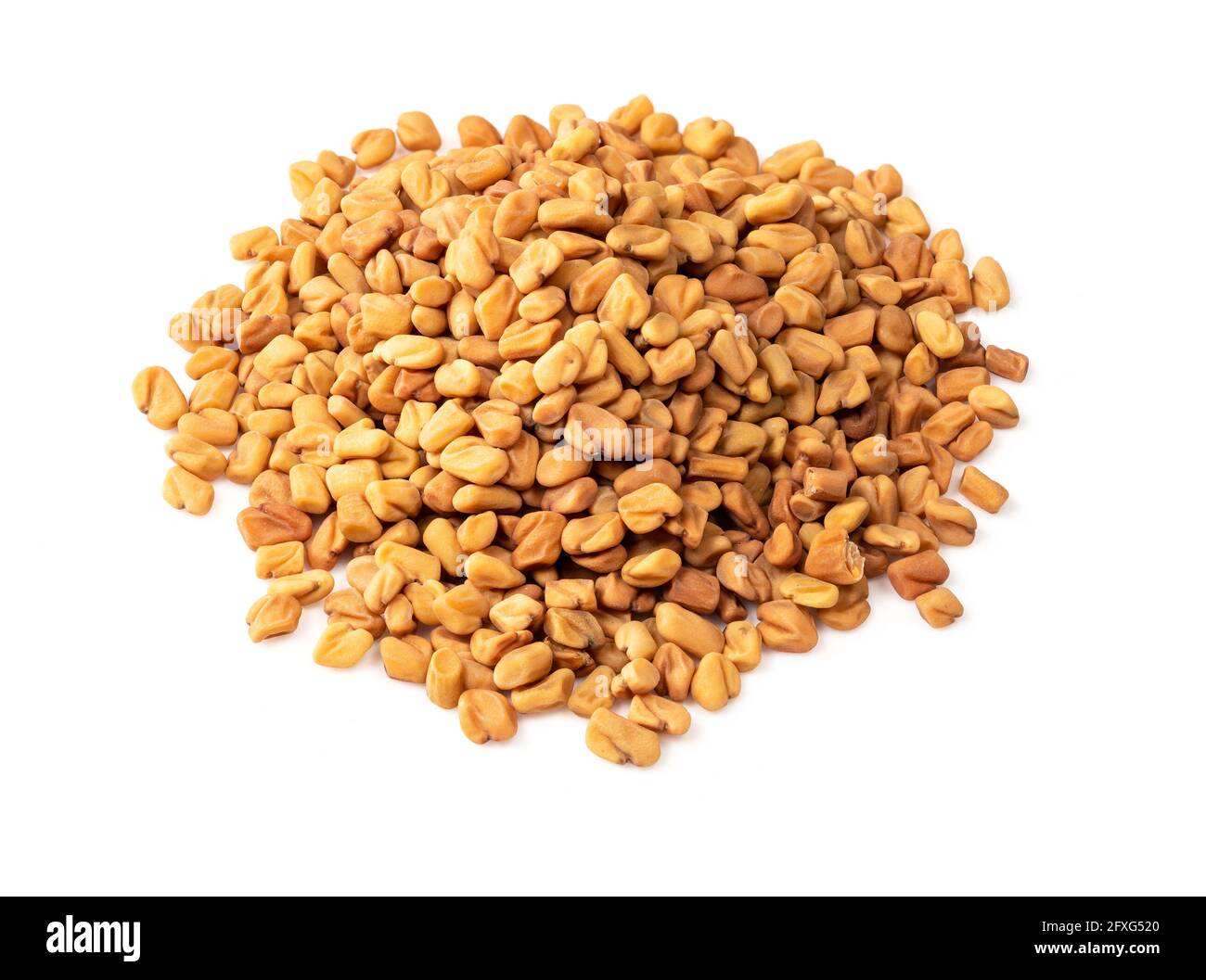 handful of Fenugreek seeds closeup on white background Stock Photo