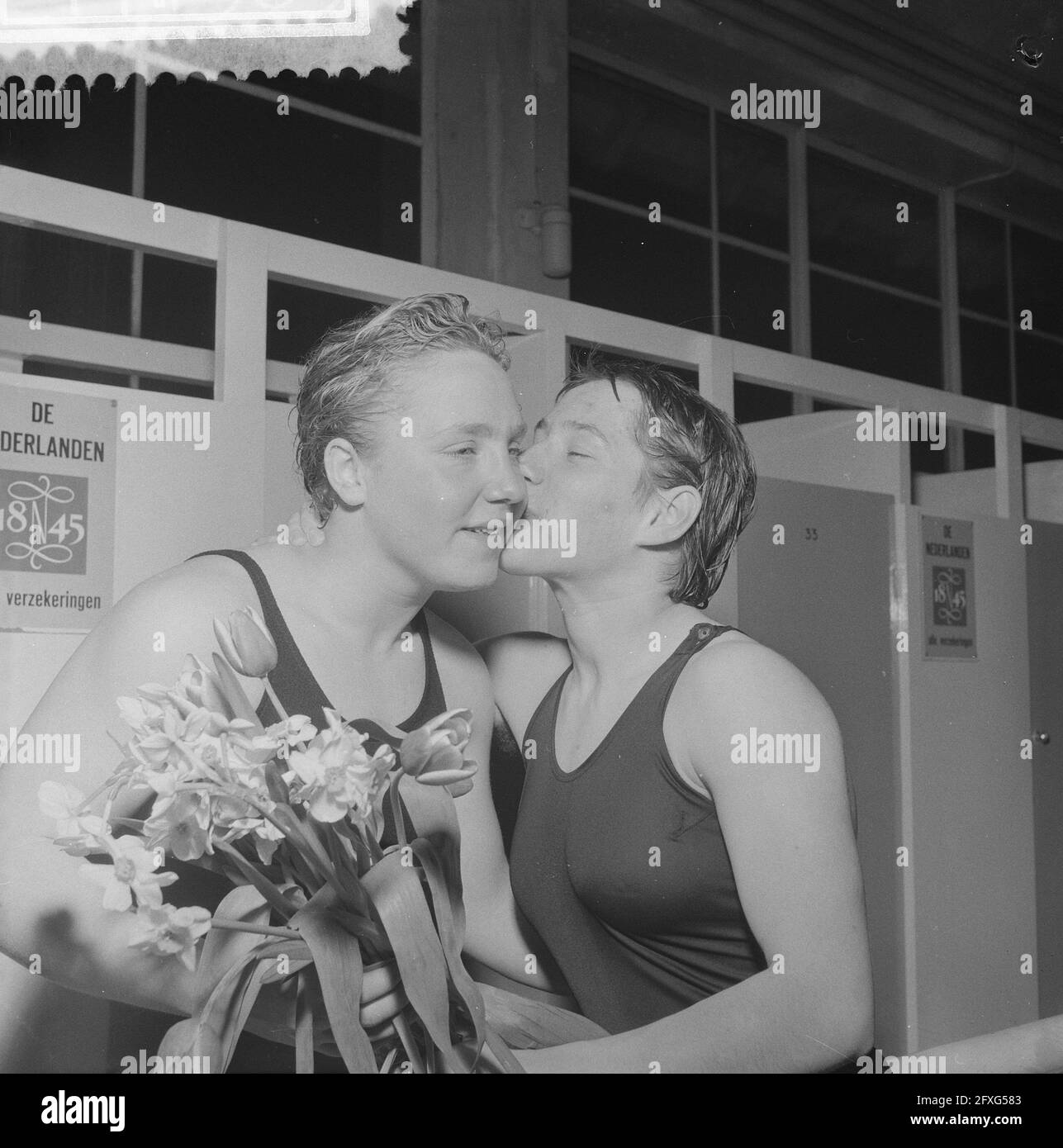Improvement of Dutch swimming records in the swimming pool Naarden, Tineke Lagerberg (l) is congratulated by W. Lambour, March 31, 1960, swimming records, The Netherlands, 20th century press agency photo, news to remember, documentary, historic photography 1945-1990, visual stories, human history of the Twentieth Century, capturing moments in time Stock Photo