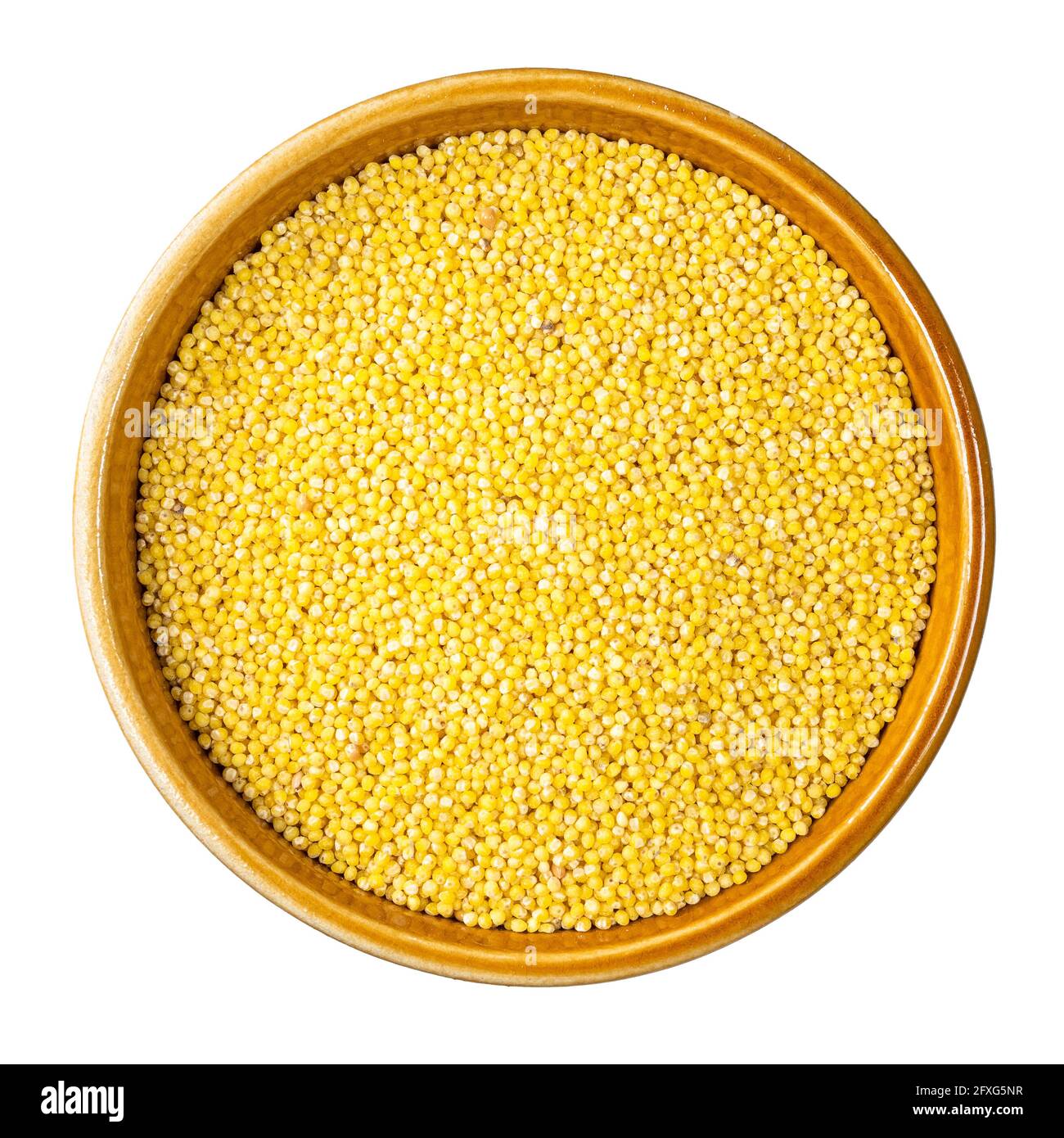 top view of millet groats from husked proso millet in round bowl cutout ...