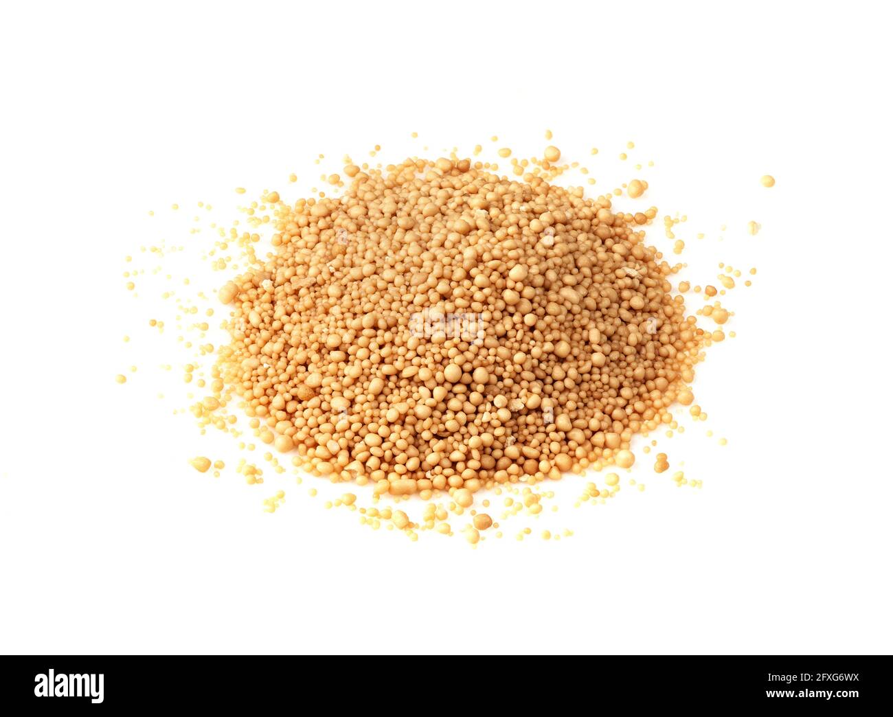 pile of granulated active dry yeast closeup on white background Stock