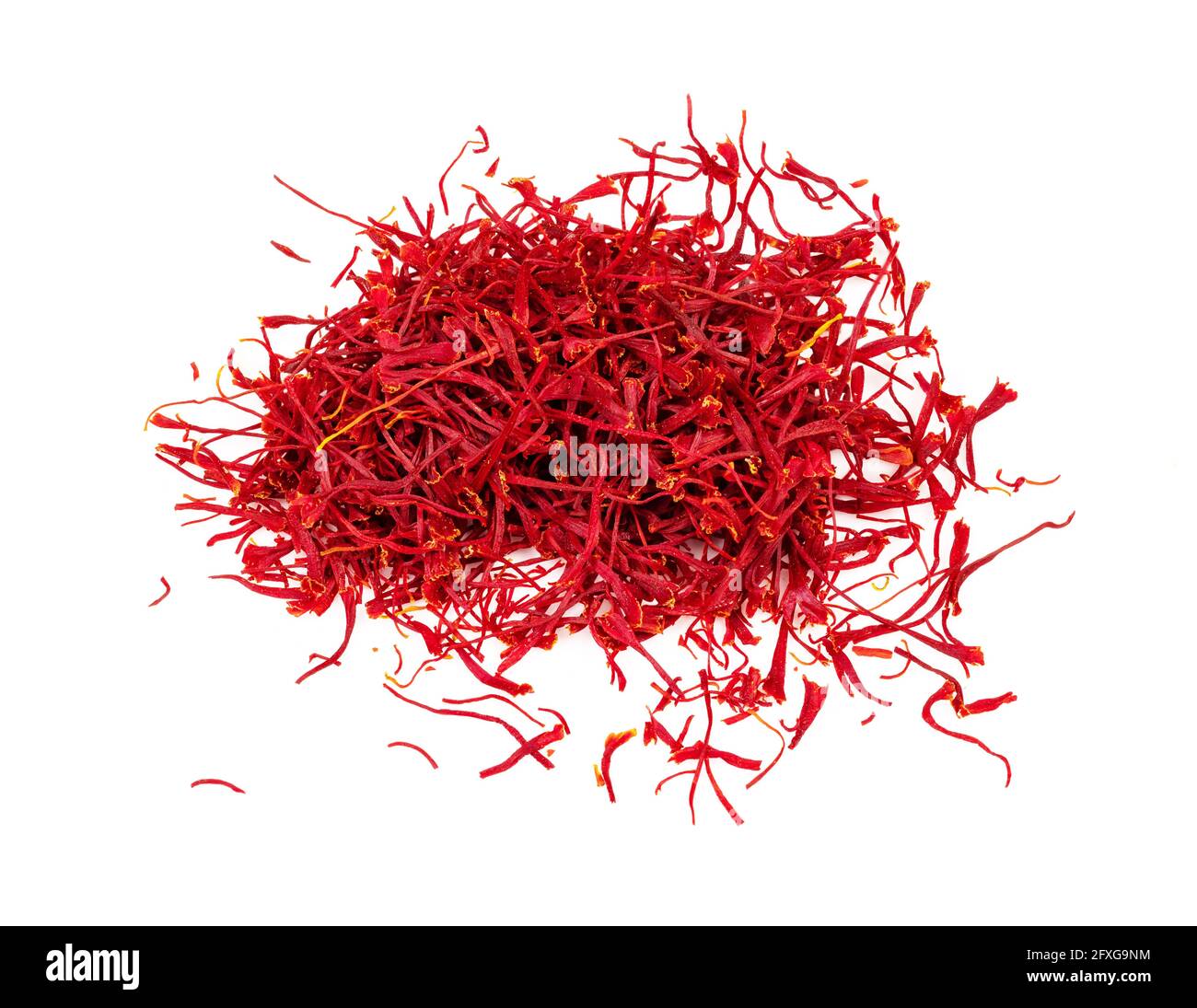 handful of natural saffron threads closeup on white background Stock