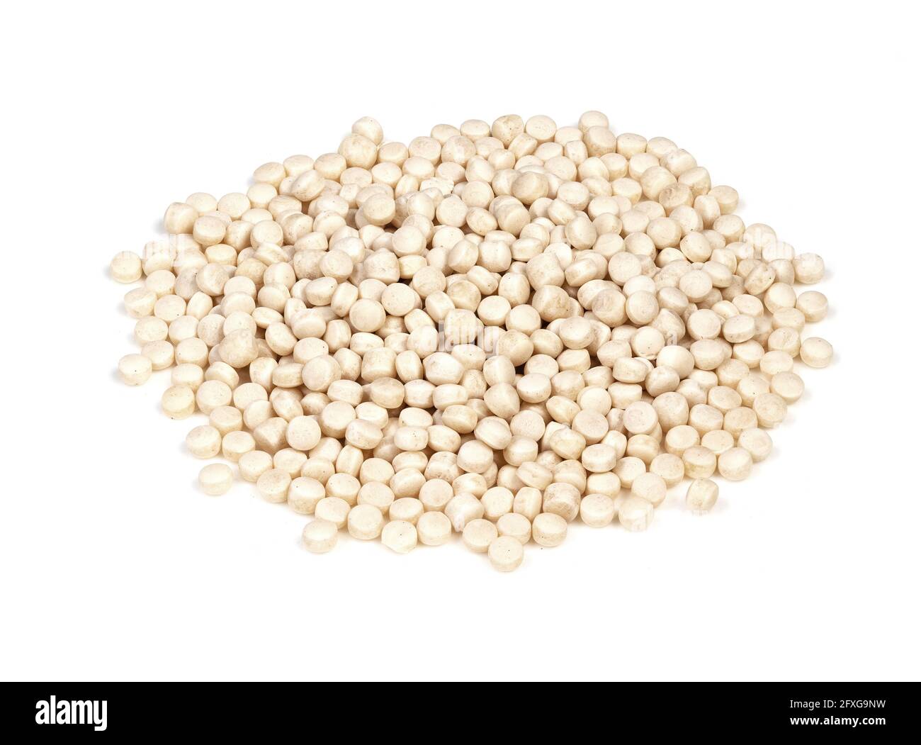 pile of uncooked ptitim (pearl couscous) closeup on white background Stock Photo