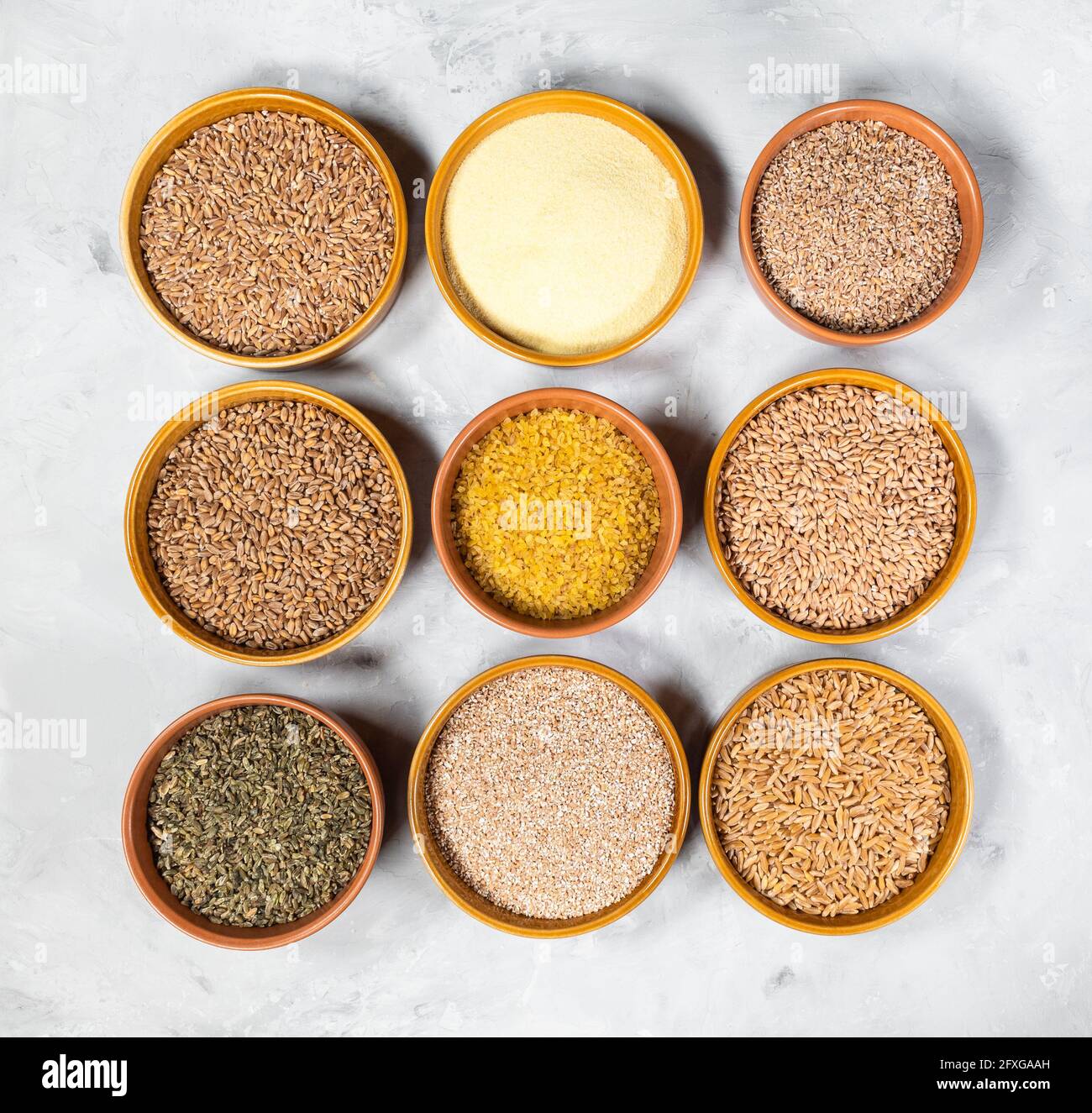 top view of various wheat grains and groats (semolina, wheat, crushed