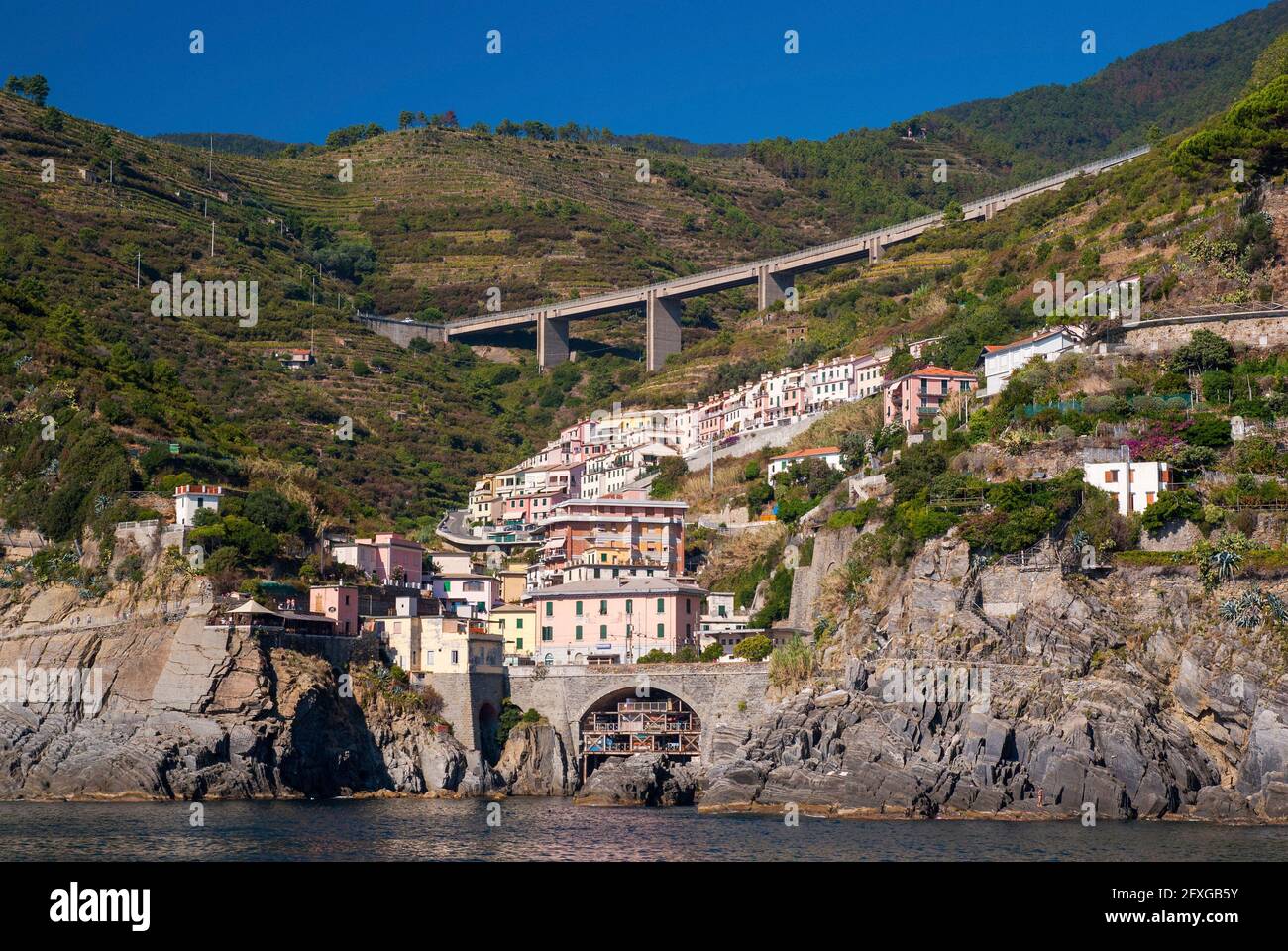 The town of Riomaggiore in Italy's Cinque Terre, taken from the ferry Stock Photo