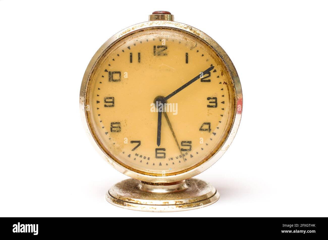 Old mechanical alarm clock on white background Stock Photo - Alamy